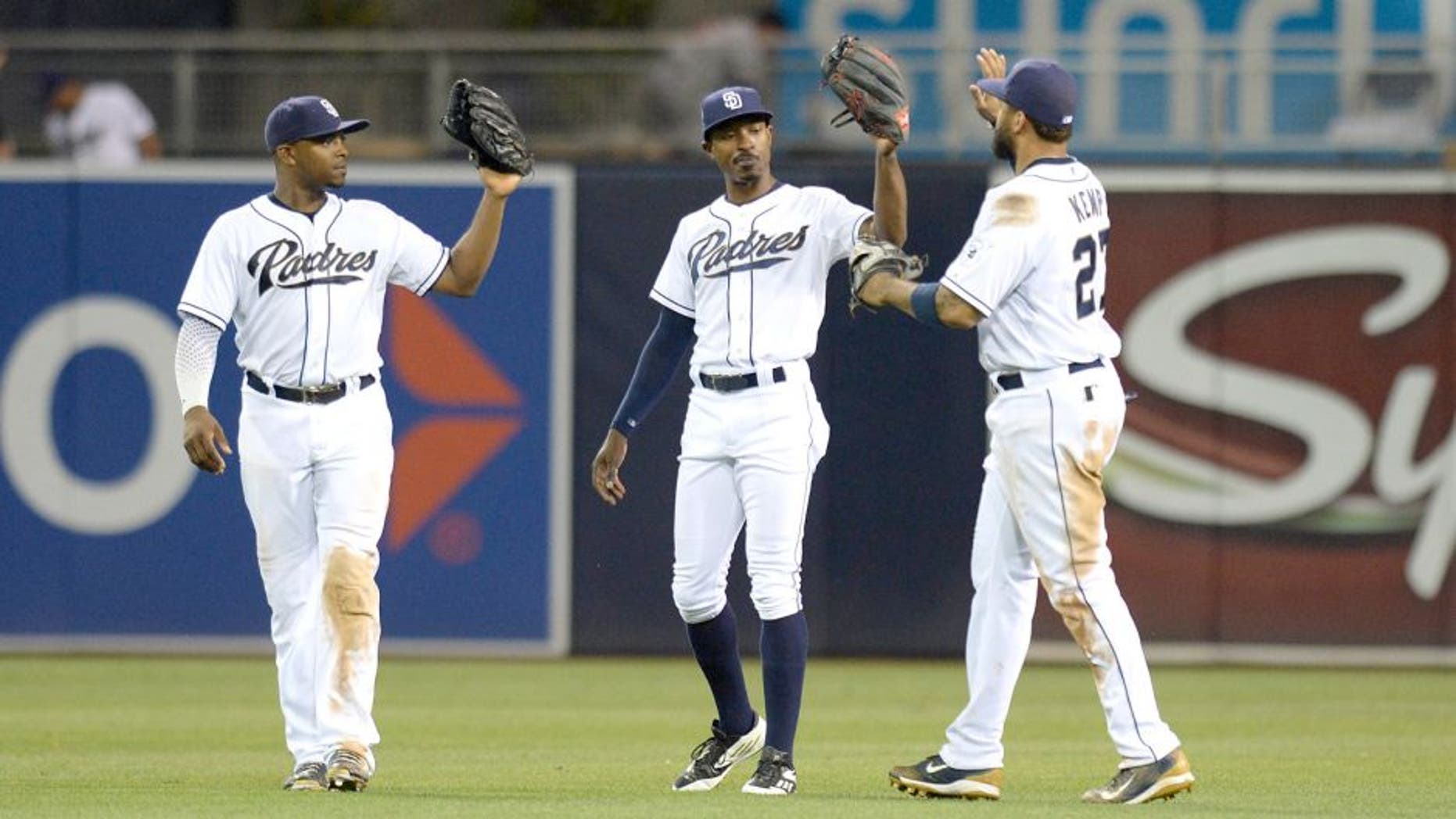Aug 17, 2015; San Diego, CA, USA; San Diego Padres left fielder Justin Upton (let), center fielder Melvin Upton Jr. (center) and right fielder Matt Kemp (27) celebrate after the Padres beat the Atlanta Braves 5-3 at Petco Park. Mandatory Credit: Jake Roth-USA TODAY Sports