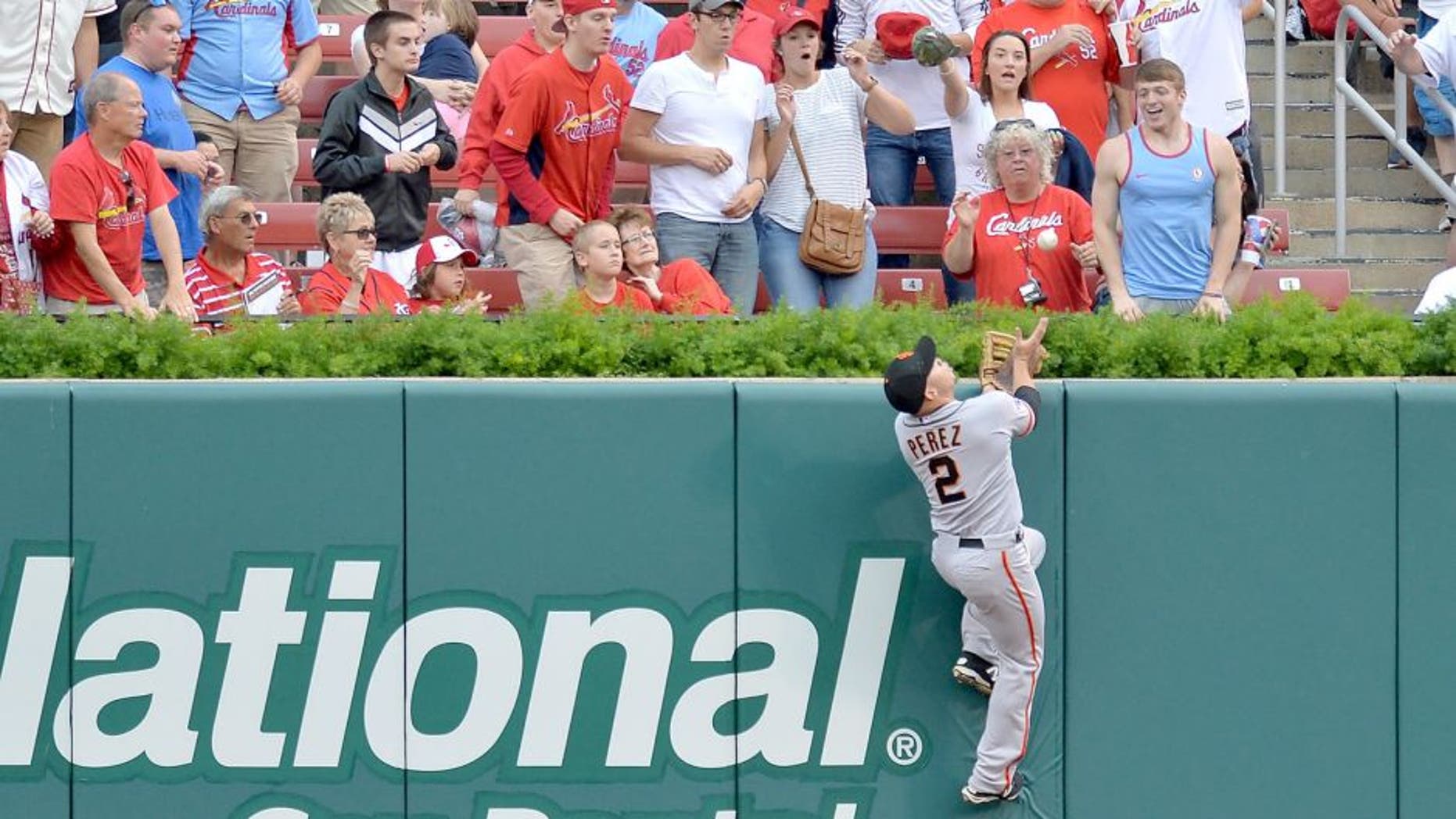 ST. LOUIS, MO - AUGUST 19: Juan Perez #2 of the San Francisco Giants makes a leaping catch at the wall in the first inning against the St. Louis Cardinals at Busch Stadium on August 19, 2015 in St. Louis, Missouri. (Photo by Michael Thomas/Getty Images)