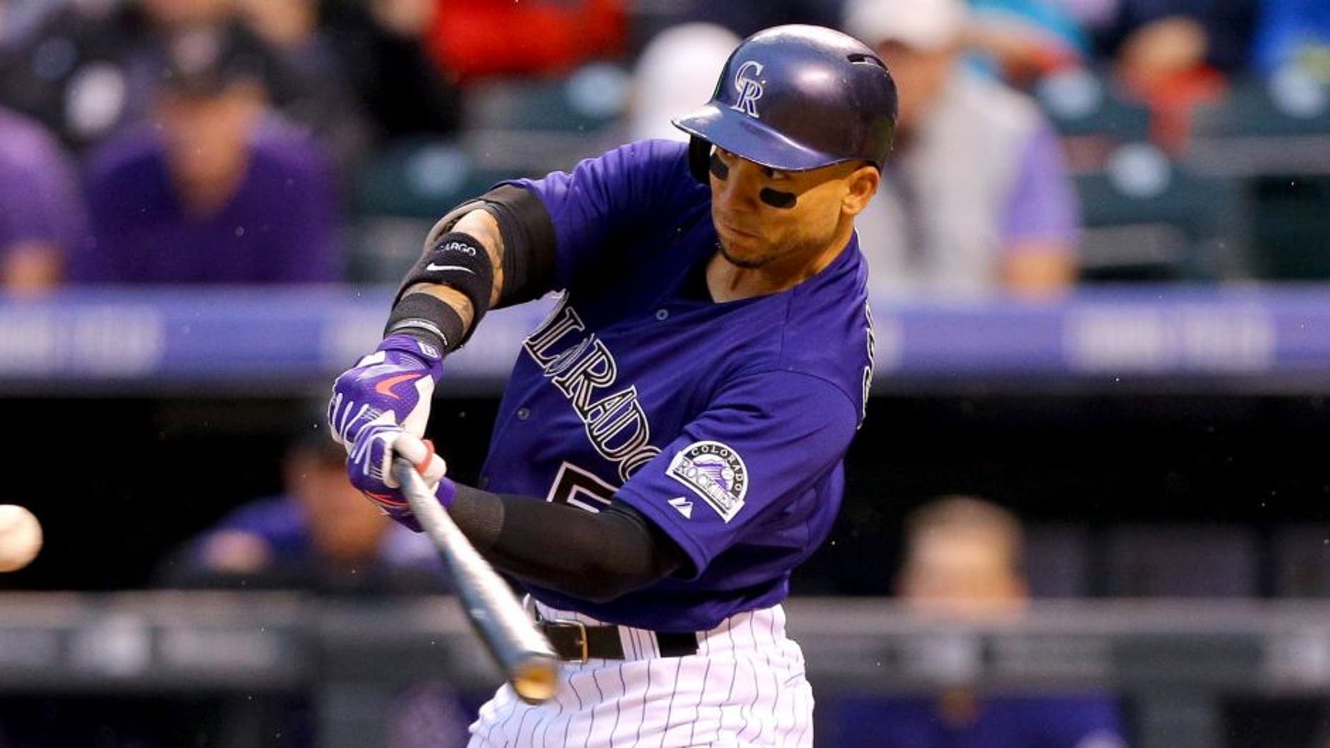 DENVER, CO - AUGUST 18: Carlos Gonzalez #5 of the Colorado Rockies hits a two run home run off of Jordan Zimmermann of the Washington Nationals during the first inning at Coors Field on August 18, 2015 in Denver, Colorado. (Photo by Justin Edmonds/Getty Images)