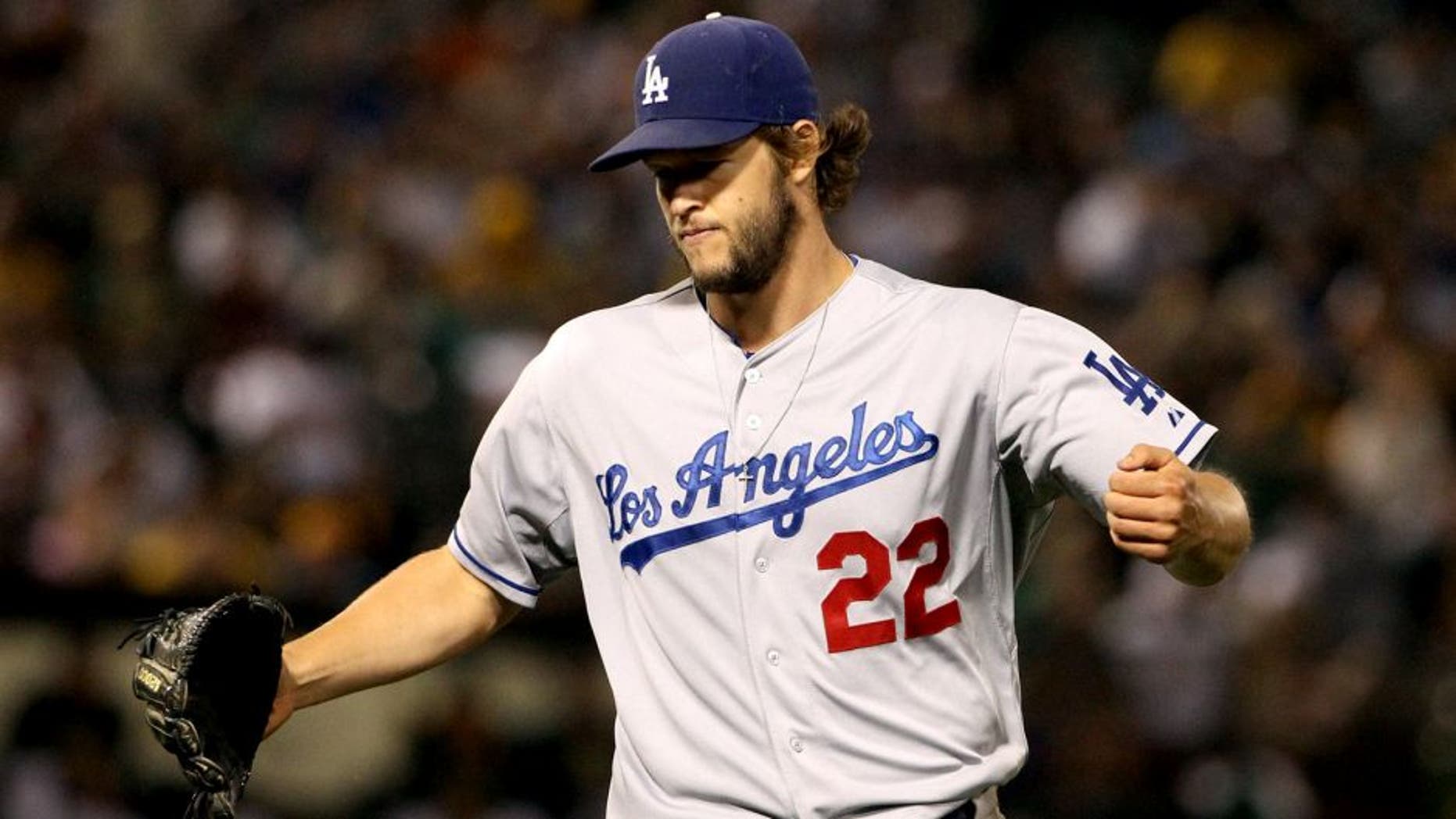 OAKLAND, CA - AUGUST 18: Clayton Kershaw #22 of the Los Angeles Dodgers reacts after the Dodgers got the last out of the seventh inning of their game against the Oakland Athletics at O.co Coliseum on August 18, 2015 in Oakland, California. (Photo by Ezra Shaw/Getty Images)