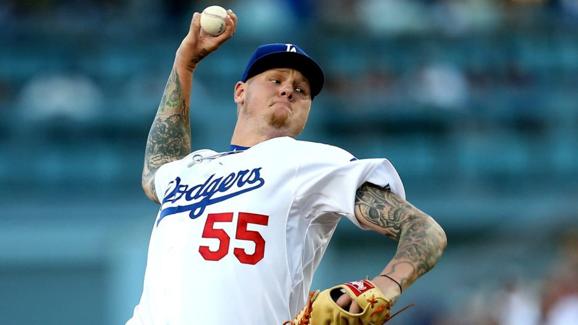 LOS ANGELES, CA - AUGUST 13: Mat Latos #55 of the Los Angeles Dodgers throws a pitch against the Cincinnati Reds at Dodger Stadium on August 13, 2015 in Los Angeles, California. (Photo by Stephen Dunn/Getty Images)