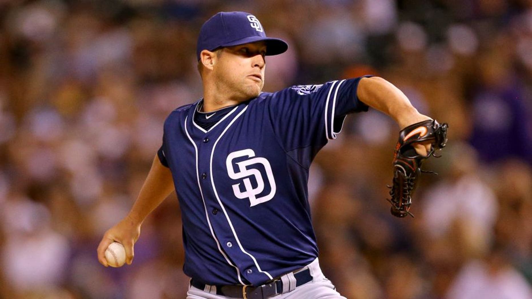 DENVER, CO - AUGUST 14: Relief pitcher Bud Norris #20 of the San Diego Padres delivers to home plate during the sixth inning against the Colorado Rockies at Coors Field on August 14, 2015 in Denver, Colorado. The Padres defeated the Rockies 9-5. (Photo by Justin Edmonds/Getty Images)