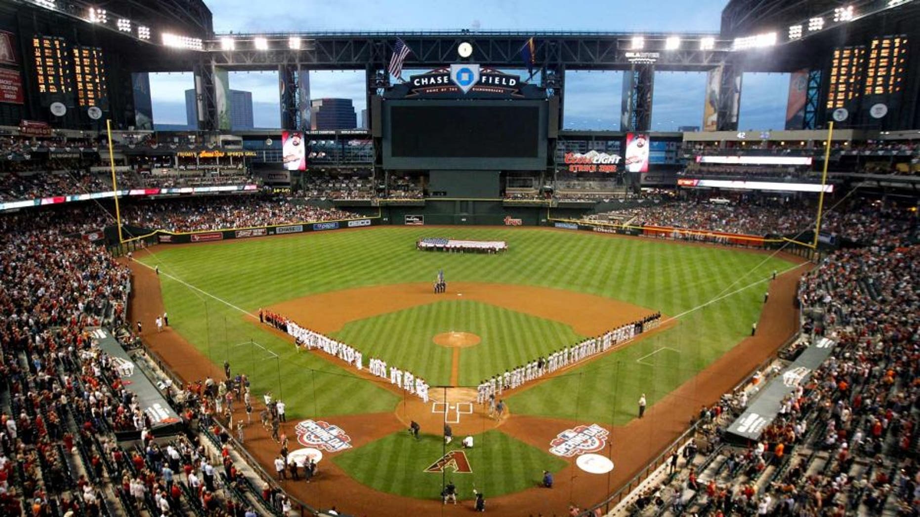 PHOENIX, AZ - APRIL 06: General view as the San Francisco Giants and the Arizona Diamondbacks stand attended for the national anthem before the Opening Day MLB game at Chase Field on April 6, 2015 in Phoenix, Arizona. (Photo by Christian Petersen/Getty Images)
