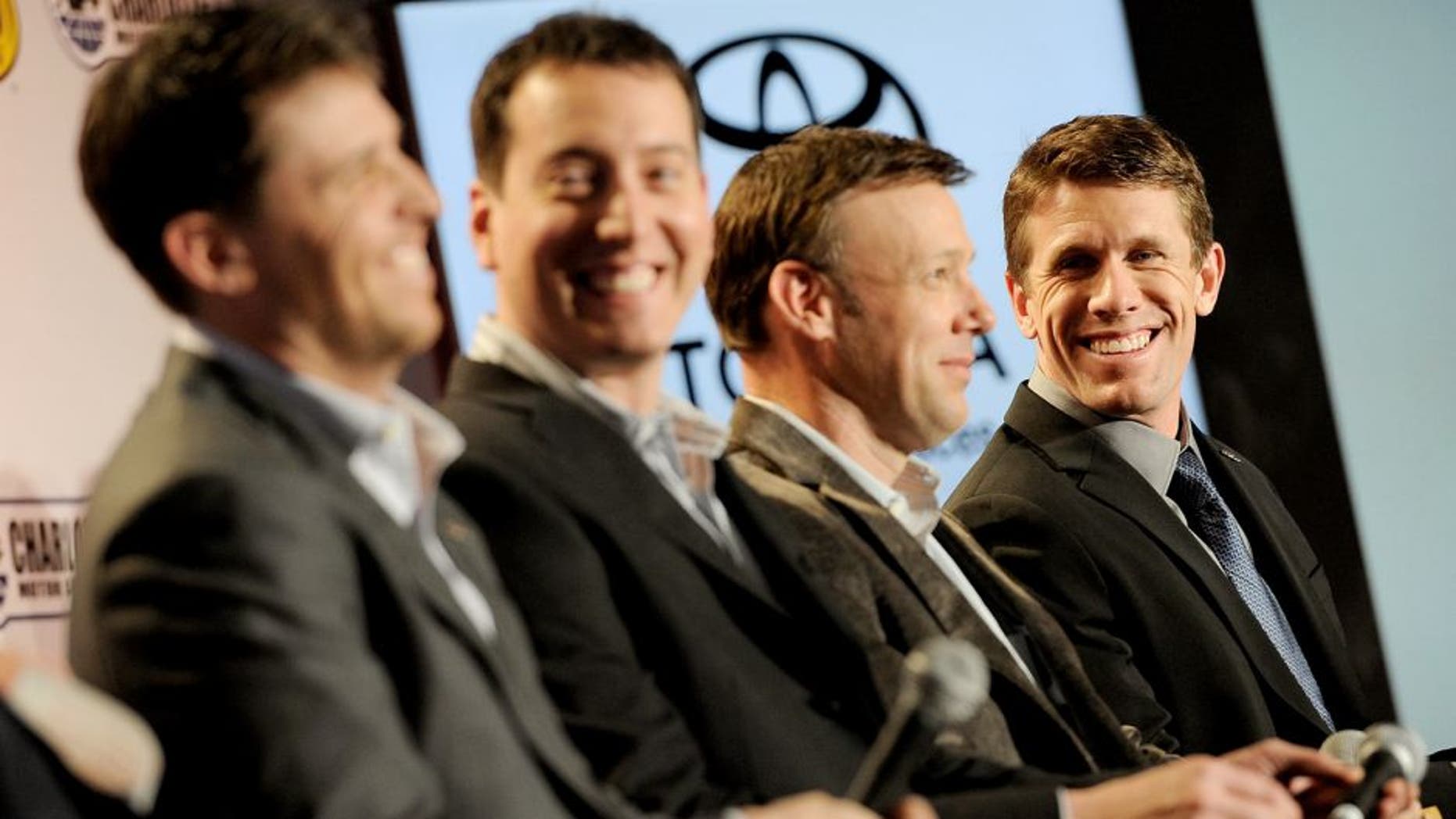 CHARLOTTE, NC - JANUARY 26: (R-L) Drivers Carl Edwards, Matt Kenseth, Kyle Busch, and Denny Hamlin look on during the NASCAR Sprint Media Tour at the Charlotte Convention Center on January 26, 2015 in Charlotte, North Carolina. (Photo by Jared C. Tilton/NASCAR via Getty Images)