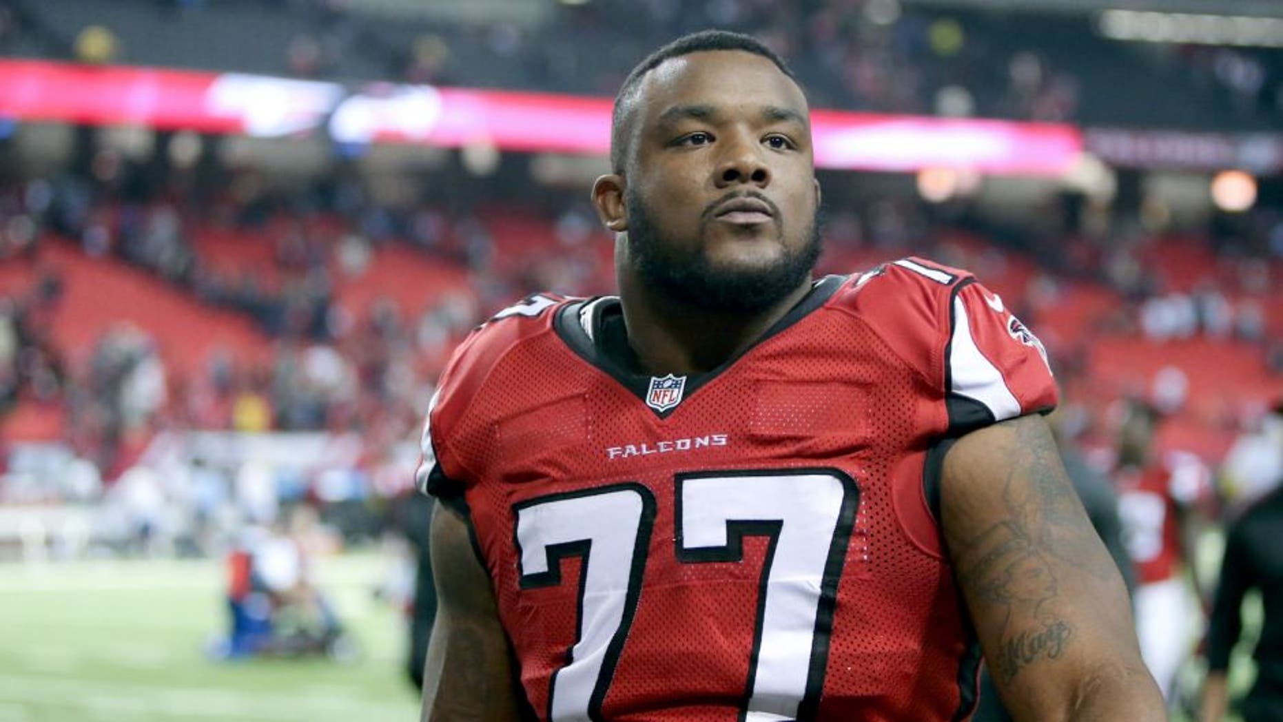 Nov 30, 2014; Atlanta, GA, USA; Atlanta Falcons defensive end Ra'Shede Hageman (77) walks off of the field after the Falcons win over the Arizona Cardinals at the Georgia Dome. The Falcons won 29-18. Mandatory Credit: Jason Getz-USA TODAY Sports