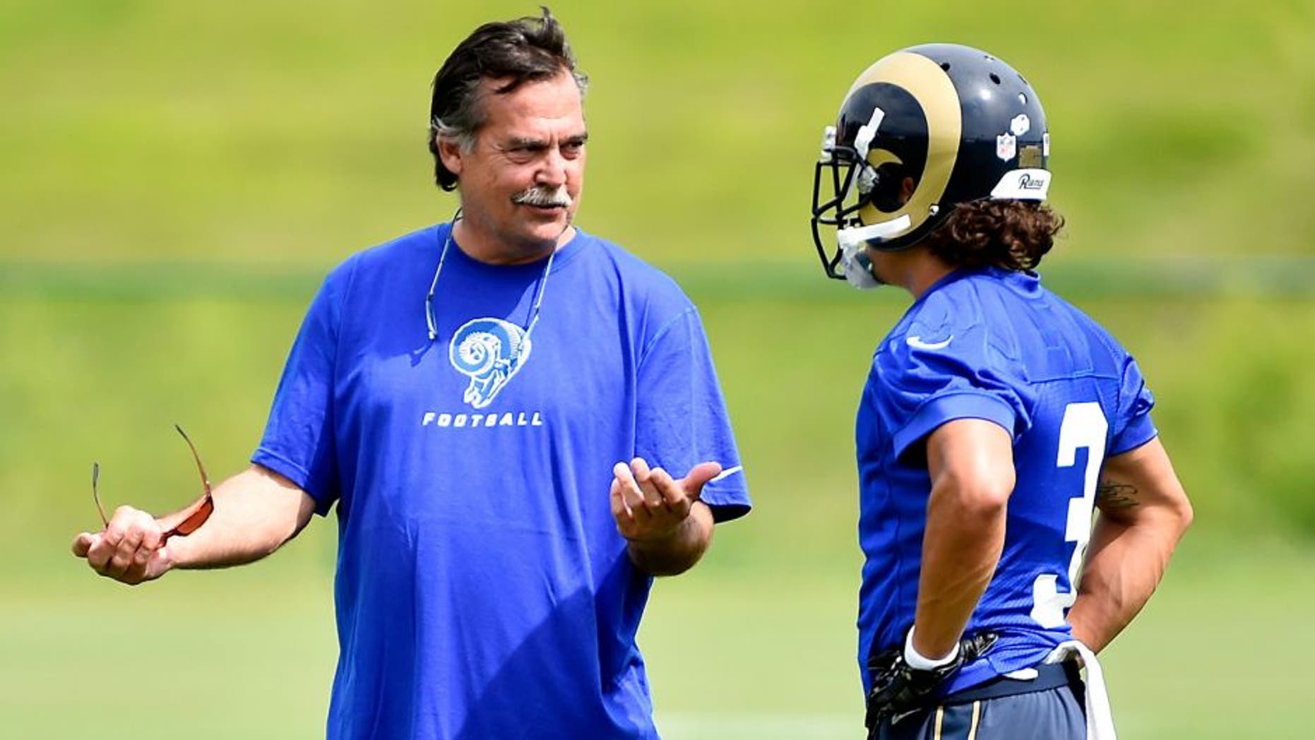 Aug 1, 2015; Earth City, MO, USA; St. Louis Rams head coach Jeff Fisher (L) talks with wide receiver Daniel Rodriguez (3) prior to practice at Rams Park. Mandatory Credit: Jasen Vinlove-USA TODAY Sports