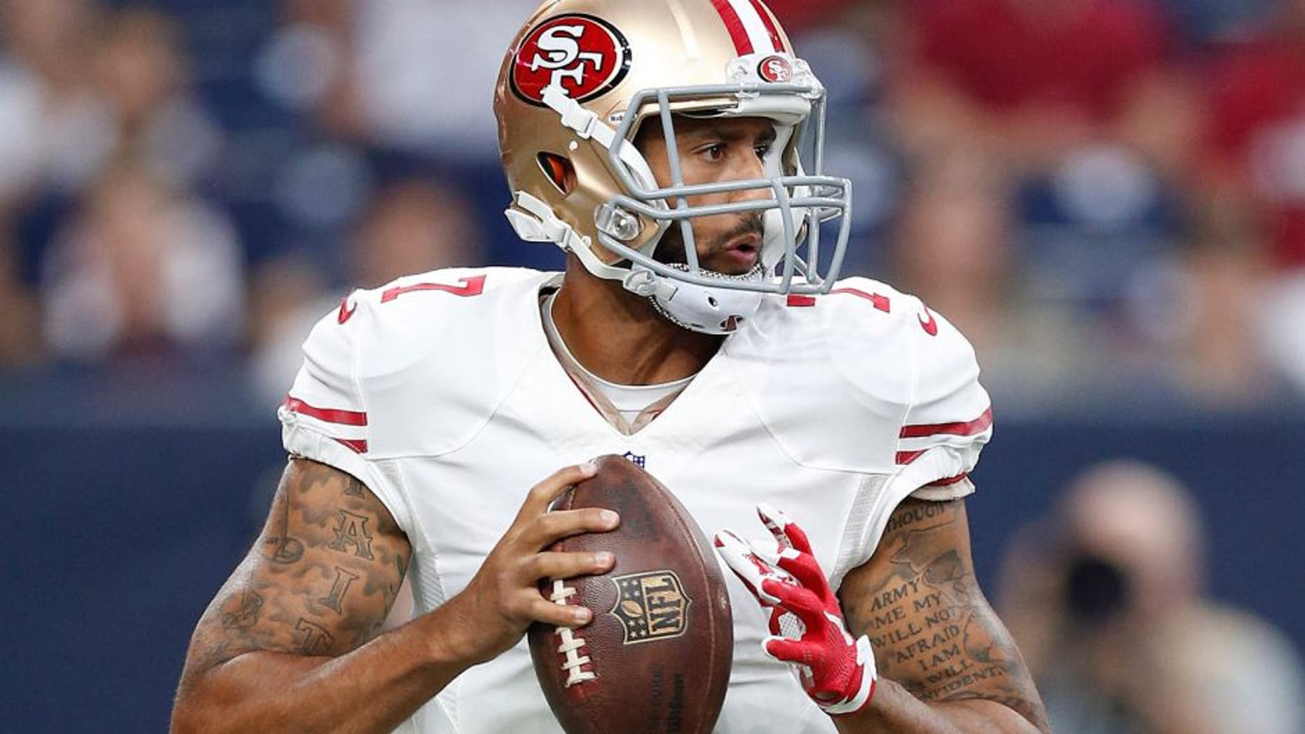 Aug 15, 2015; Houston, TX, USA; San Francisco 49ers quarterback Colin Kaepernick (7) drops back to pass against the Houston Texans in a preseason NFL football game at NRG Stadium. Mandatory Credit: Matthew Emmons-USA TODAY Sports