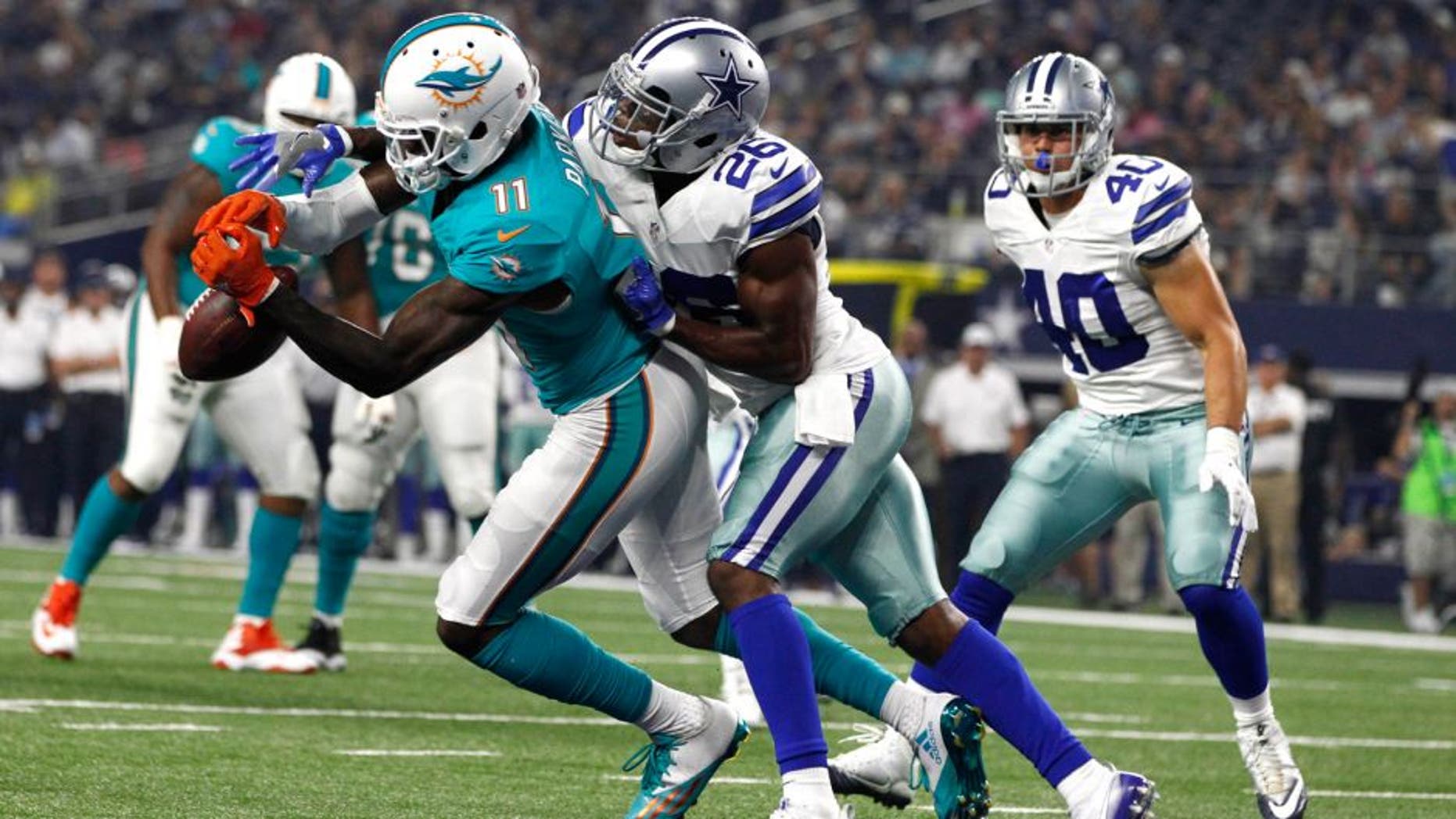 Aug 19, 2016; Arlington, TX, USA; Dallas Cowboys defensive back Josh Thomas (26) defends a pass against Miami Dolphins wide receiver DeVante Parker (11) in the second quarter at AT&T Stadium. Mandatory Credit: Tim Heitman-USA TODAY Sports
