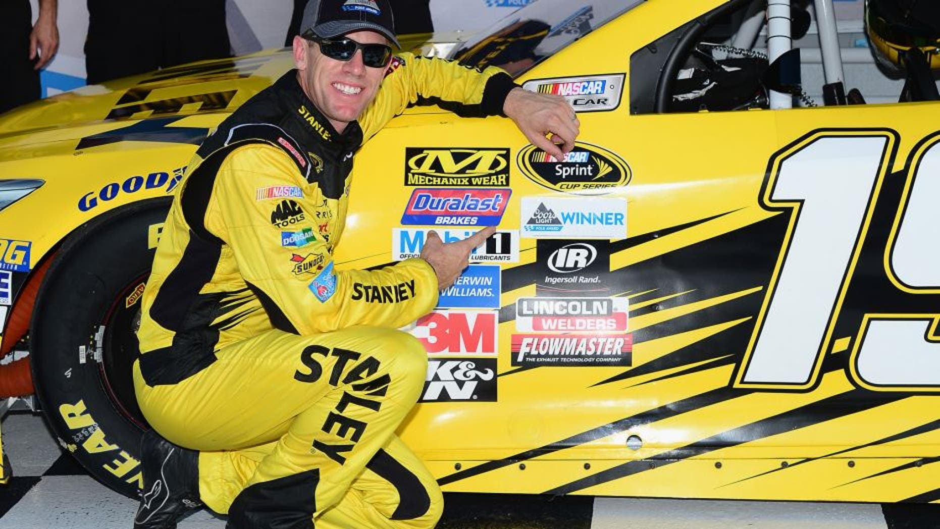 BRISTOL, TN - AUGUST 19: Carl Edwards, driver of the #19 Stanley Toyota, poses with the Coors Light Pole award after qualifying for the pole position for the NASCAR Sprint Cup Series Bass Pro Shops NRA Night Race at Bristol Motor Speedway on August 19, 2016 in Bristol, Tennessee. (Photo by Jeff Curry/NASCAR via Getty Images)