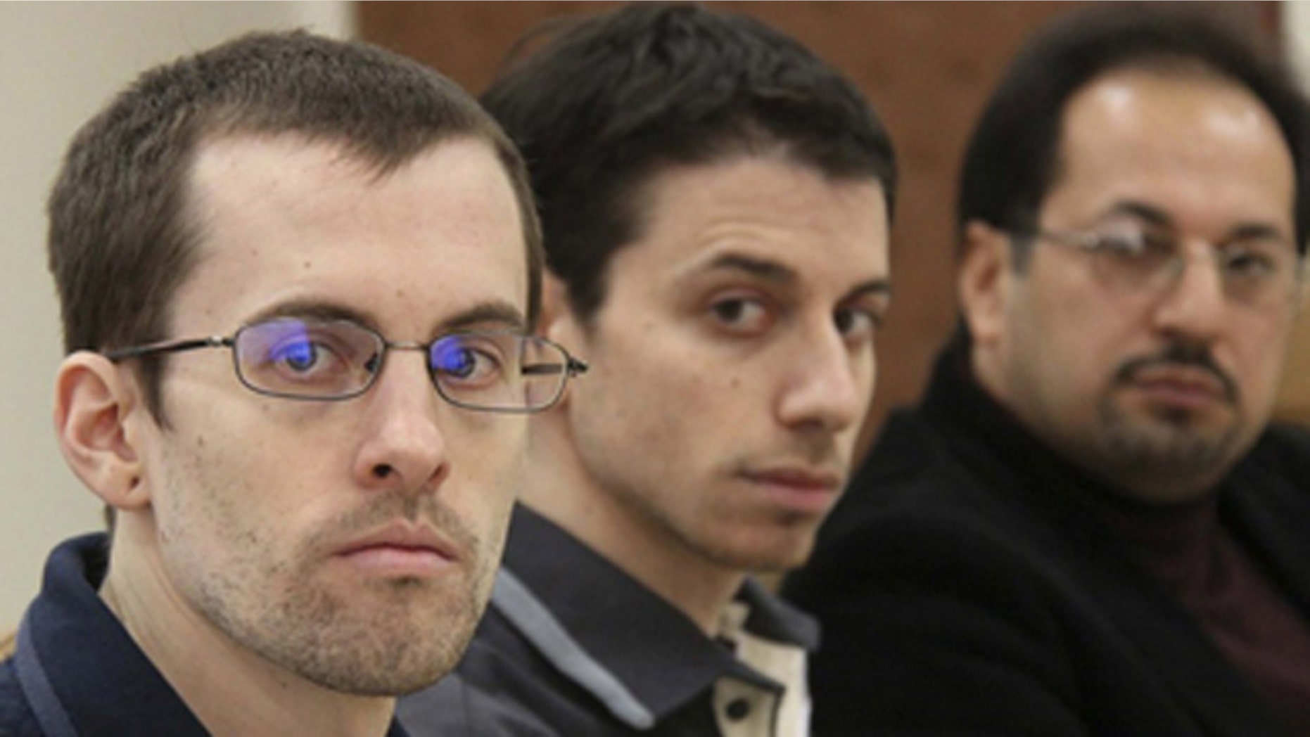 Feb. 6: American hikers Shane Bauer, left, and Josh Fattal, center, and their translator attend the first session of their trial at the revolutionary court in Tehran.