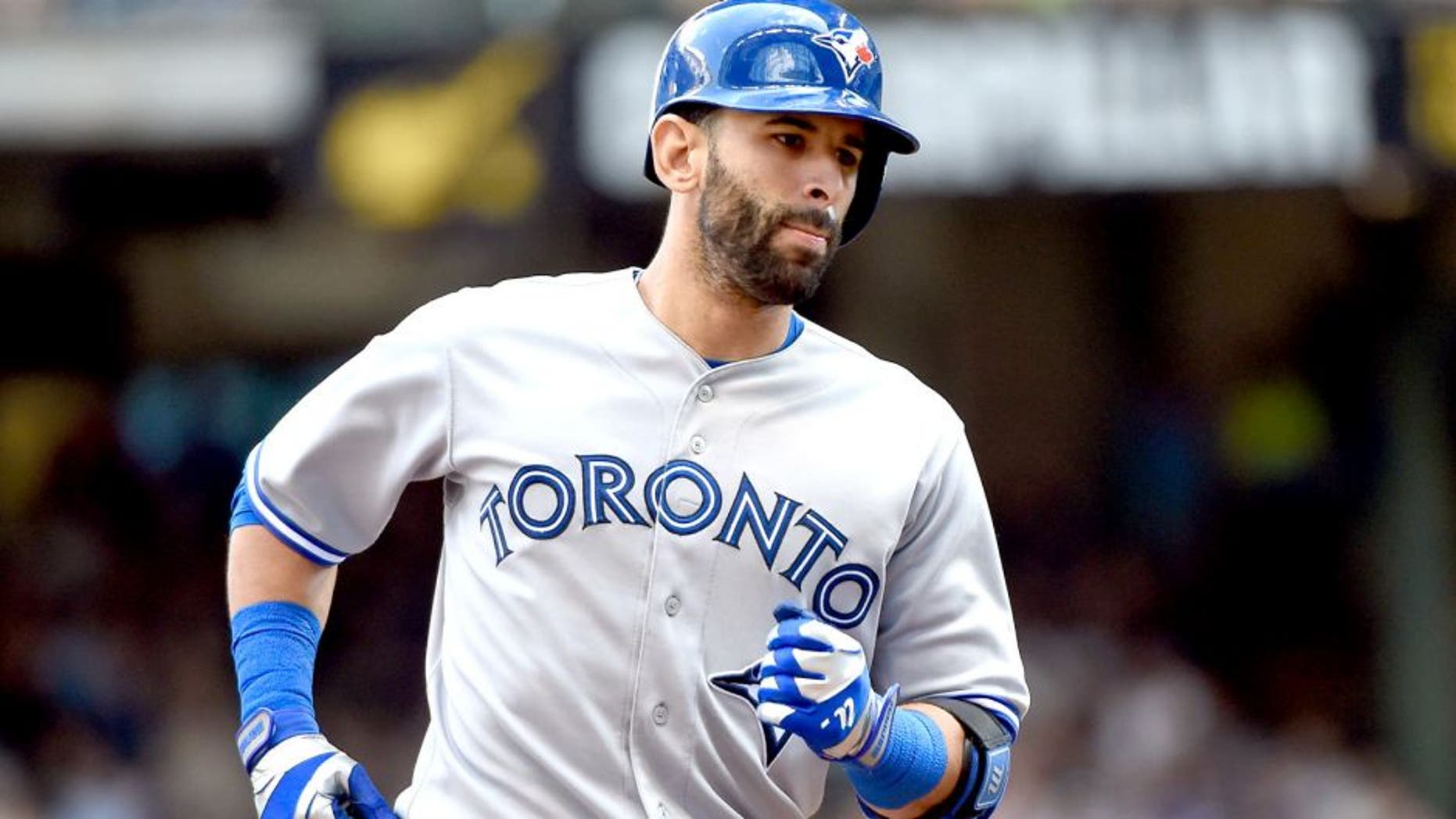 Aug 20, 2014; Milwaukee, WI, USA; Toronto Blue Jays right fielder Jose Bautista (19) runs the bases after hitting a 3-run home run in the sixth inning against the Milwaukee Brewers at Miller Park. Mandatory Credit: Benny Sieu-USA TODAY Sports