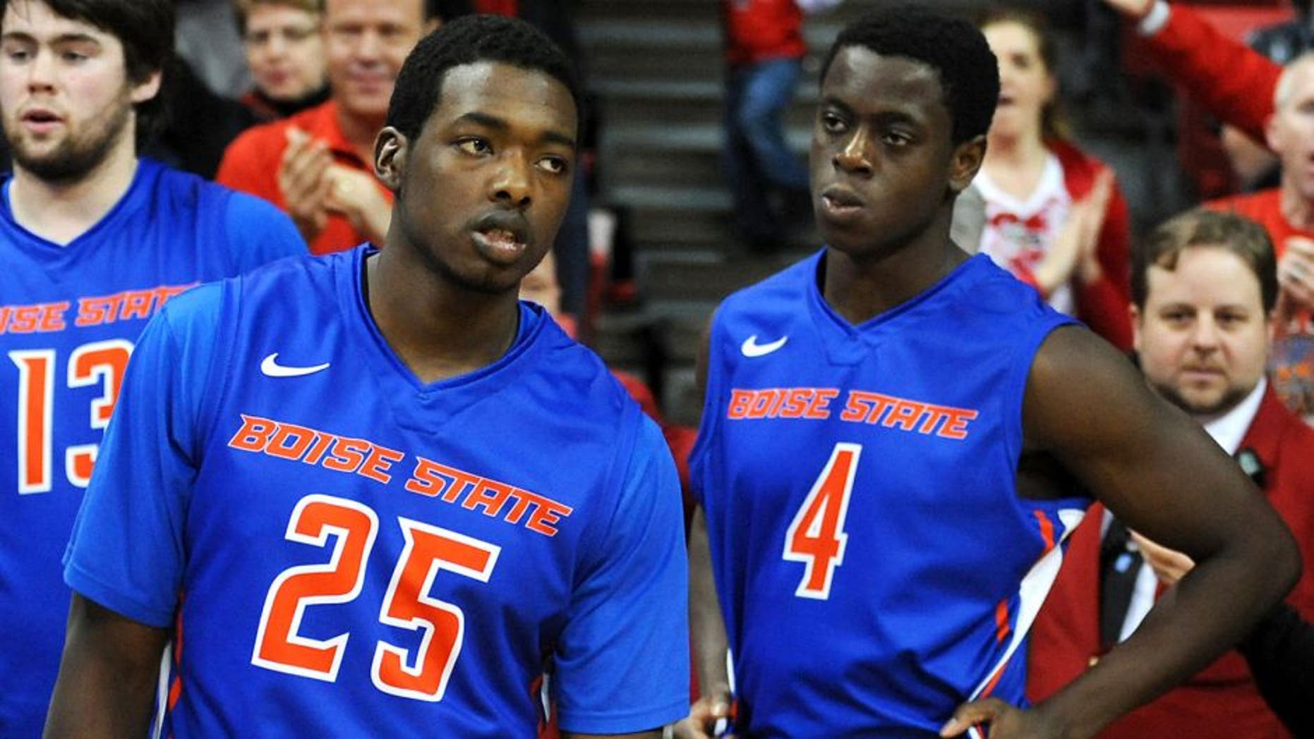 Feb 1, 2014; Las Vegas, NV, USA; Boise State Broncos players Dezmyn Trent (25) and Thomas Bropleh (4) react after the game against the UNLV Runnin' Rebels at Thomas & Mack Center. The Rebels won the game 73-69. Mandatory Credit: Stephen R. Sylvanie-USA TODAY Sports