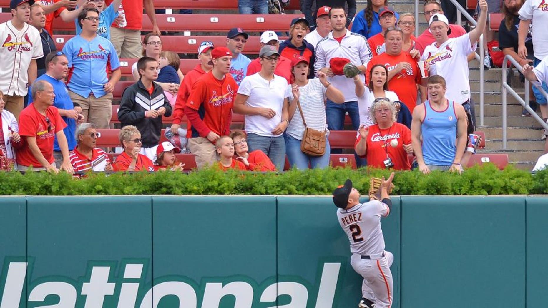 ST. LOUIS, MO - AUGUST 19: Juan Perez #2 of the San Francisco Giants makes a leaping catch at the wall in the first inning against the St. Louis Cardinals at Busch Stadium on August 19, 2015 in St. Louis, Missouri. (Photo by Michael Thomas/Getty Images)