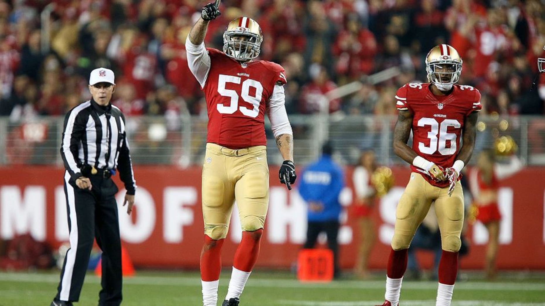 SANTA CLARA, CA - NOVEMBER 27: Aaron Lynch #59 of the San Francisco 49ers celebrates after a sack against the Seattle Seahawks at Levi's Stadium on November 27, 2014 in Santa Clara, California. (Photo by Brian Bahr/Getty Images)