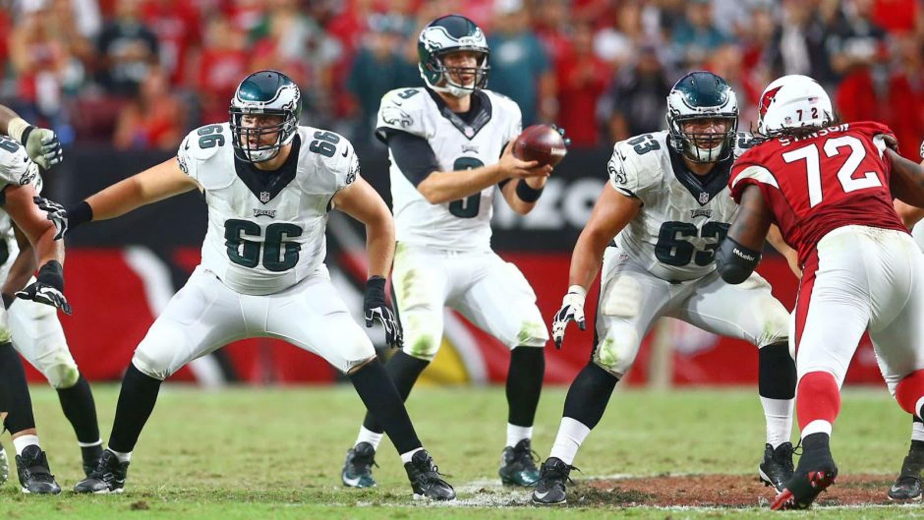 Oct 26, 2014; Glendale, AZ, USA; Philadelphia Eagles tackle Andrew Gardner (66) and center David Molk (63) against the Arizona Cardinals at University of Phoenix Stadium. The Cardinals defeated the Eagles 24-20. Mandatory Credit: Mark J. Rebilas-USA TODAY Sports