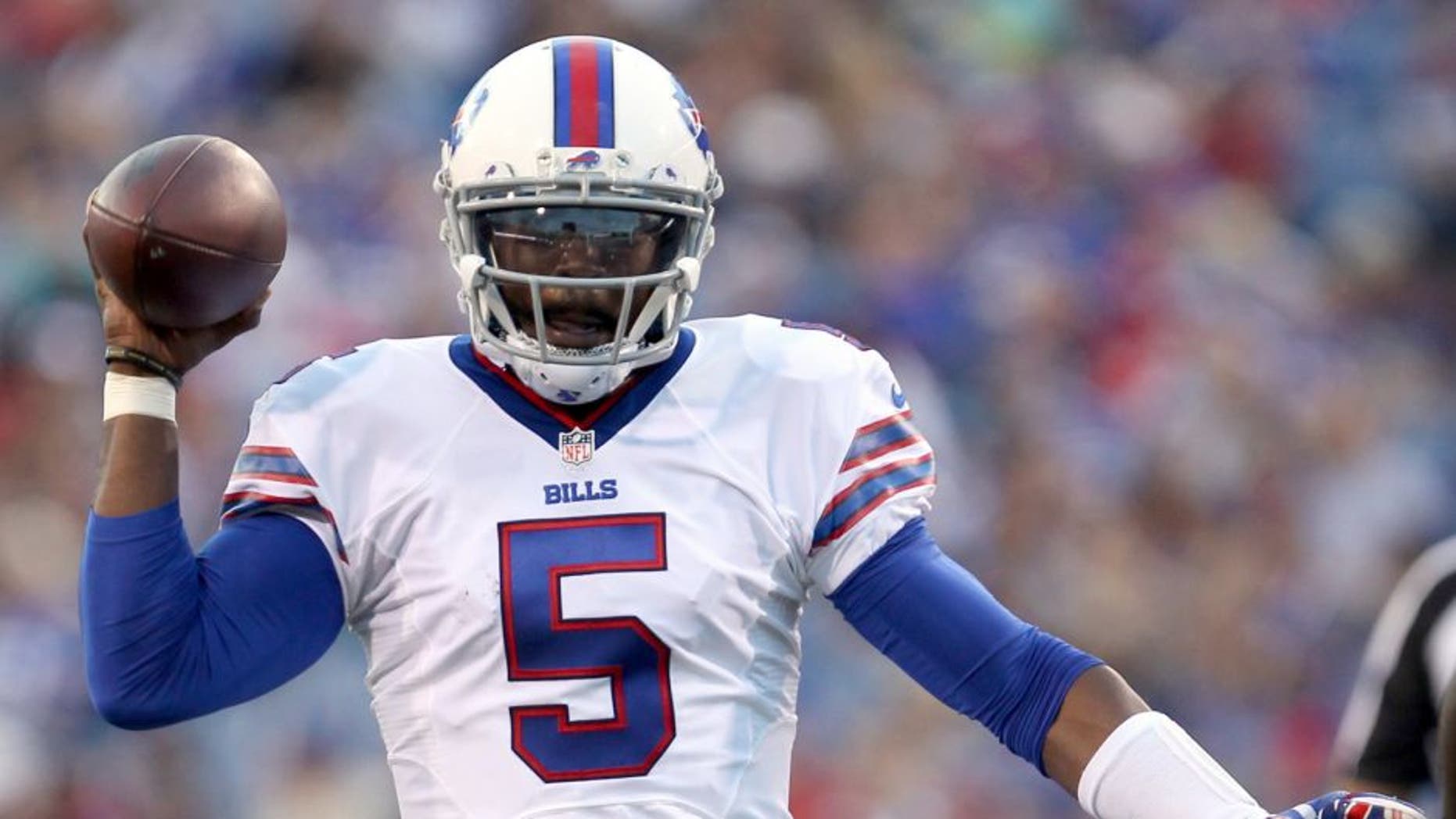 Aug 14, 2015; Orchard Park, NY, USA; Buffalo Bills quarterback Tyrod Taylor (5) throws a pass during the first half against the Carolina Panthers in a preseason NFL football game at Ralph Wilson Stadium. Mandatory Credit: Timothy T. Ludwig-USA TODAY Sports
