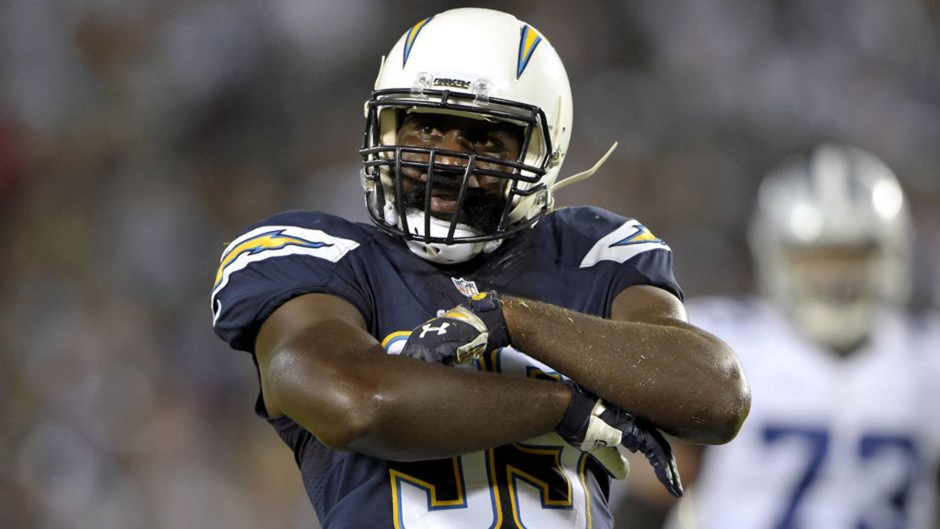 Aug 13, 2015; San Diego, CA, USA; San Diego Chargers linebacker Cordarro Law (99) celebrates after a tackle against the Dallas Cowboys in a preseason NFL football game at Qualcomm Stadium. Mandatory Credit: Kirby Lee-USA TODAY Sports