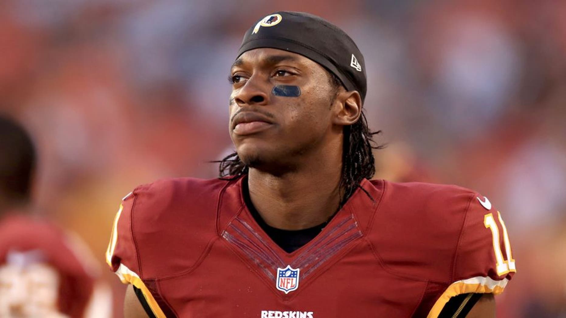 Aug 13, 2015; Cleveland, OH, USA; Washington Redskins quarterback Robert Griffin III (10) on the sidelines during the first quarter of preseason NFL football game against the Cleveland Browns at FirstEnergy Stadium. Mandatory Credit: Andrew Weber-USA TODAY Sports