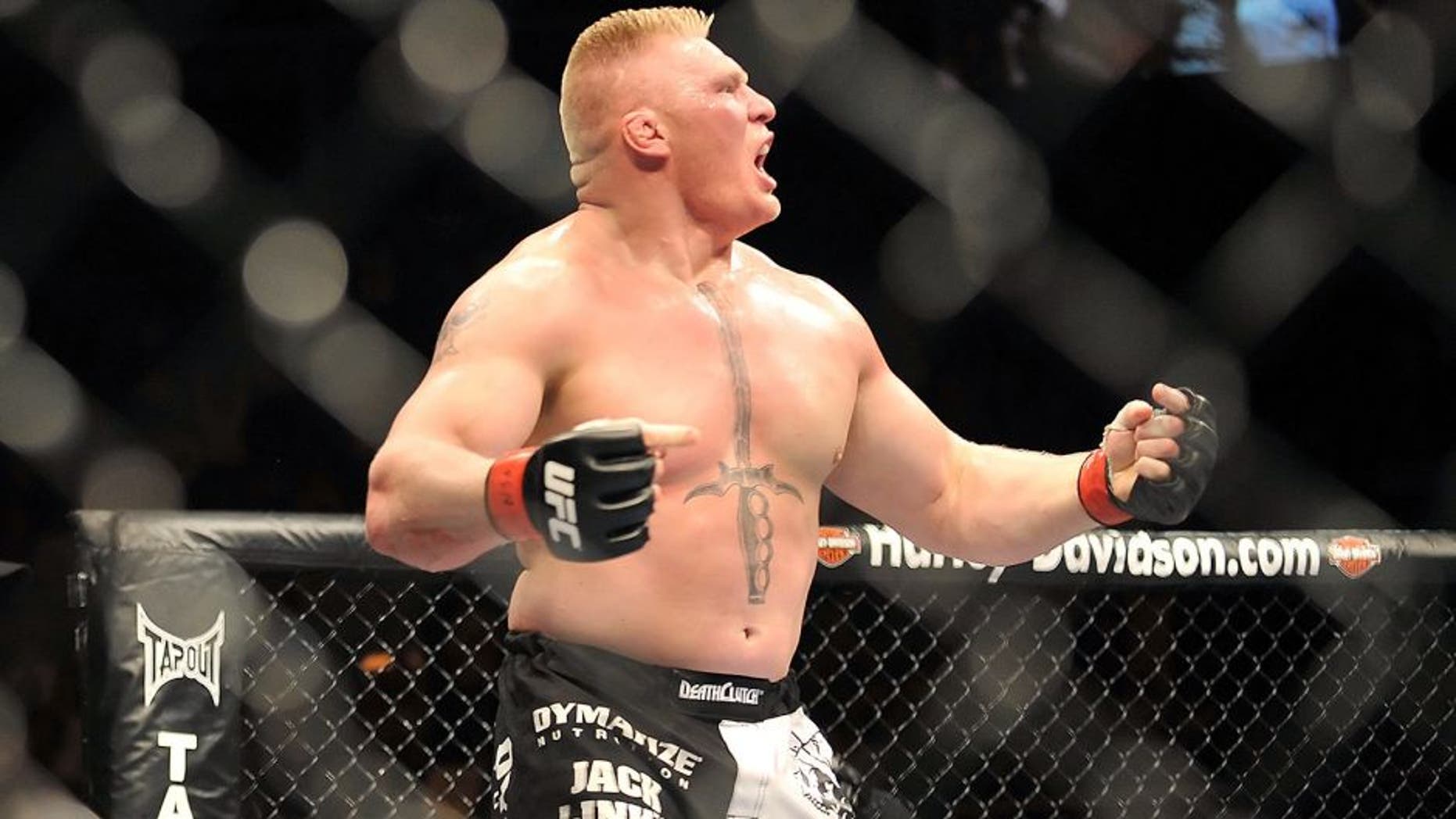 LAS VEGAS - JULY 11: Brock Lesnar reacts after knocking out Frank Mir during their heavyweight title bout during UFC 100 on July 11, 2009 in Las Vegas, Nevada. (Photo by Jon Kopaloff/Getty Images) *** Local Caption *** Brock Lesnar