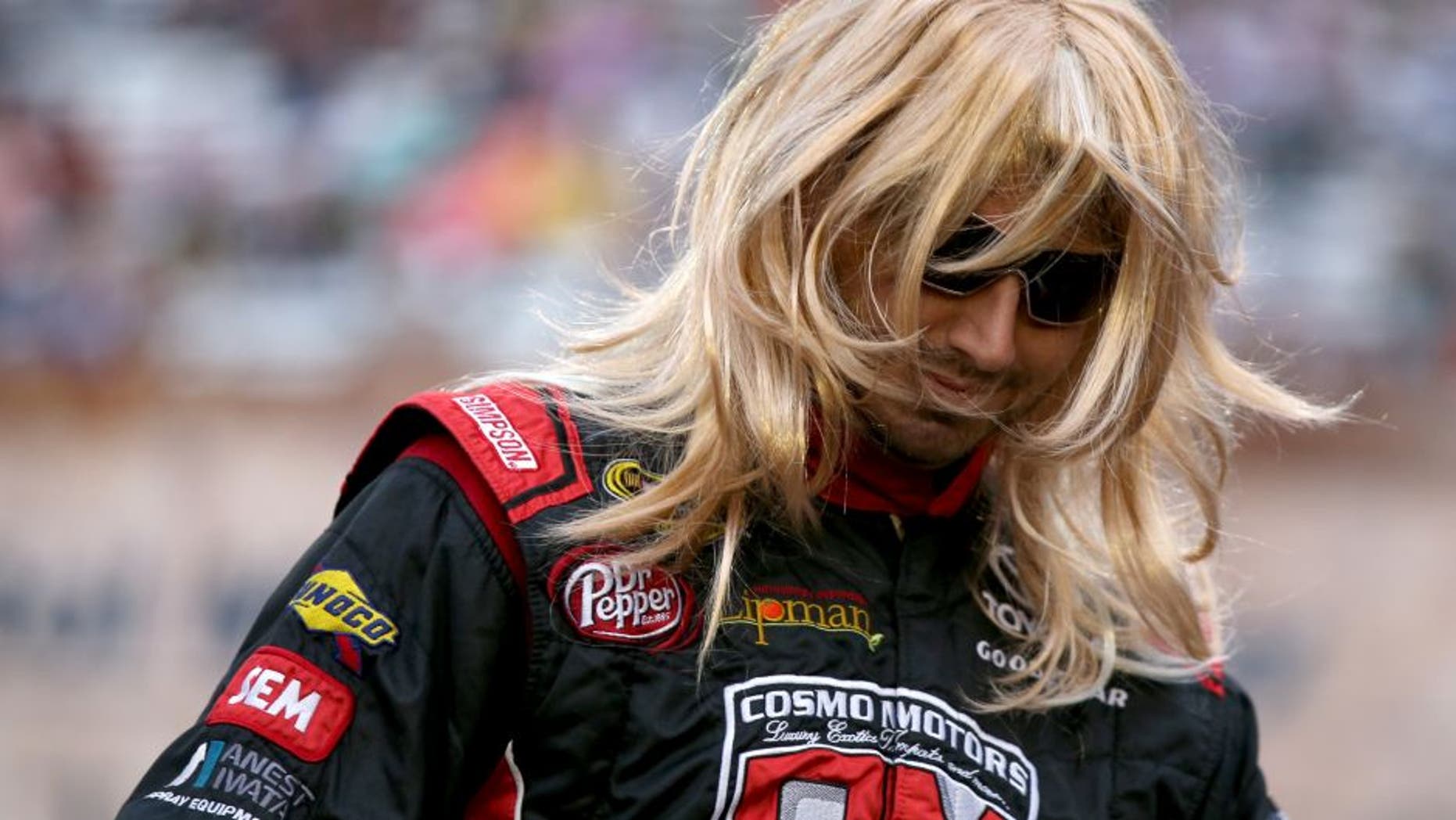 BRISTOL, TN - AUGUST 20: Matt DiBenedetto, driver of the #83 Cosmo Motors Toyota, is introduced in a wig prior to the NASCAR Sprint Cup Series Bass Pro Shops NRA Night Race at Bristol Motor Speedway on August 20, 2016 in Bristol, Tennessee. (Photo by Sean Gardner/Getty Images)