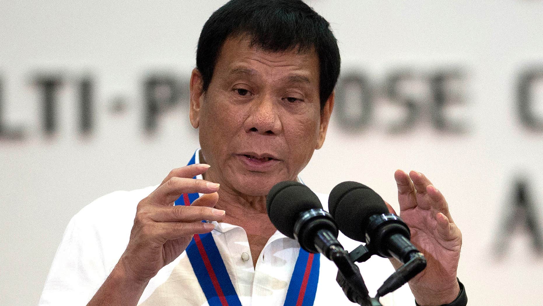 FILE - In this Wednesday, Aug. 17, 2016 file photo, Philippine President Rodrigo Duterte gestures as he talks during the 115th Police Service Anniversary at the Philippine National Police headquarters in Manila.