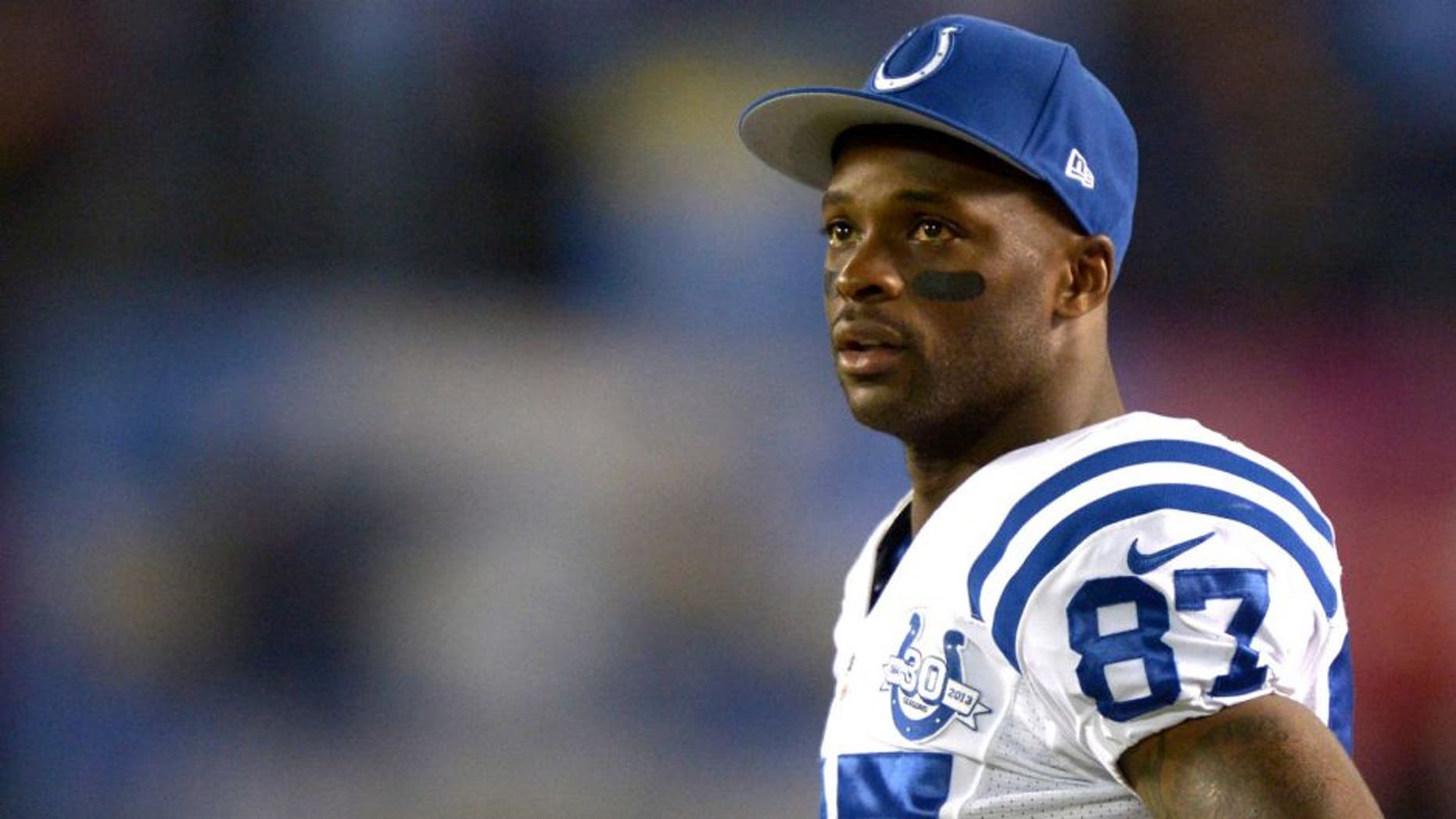 Oct 14, 2013; San Diego, CA, USA; Indianapolis Colts receiver Reggie Wayne (87) watches on the sidelines during the game against the San Diego Chargers at Qualcomm Stadium. The Chargers defeated the Colts 19-9. Mandatory Credit: Kirby Lee-USA TODAY Sports