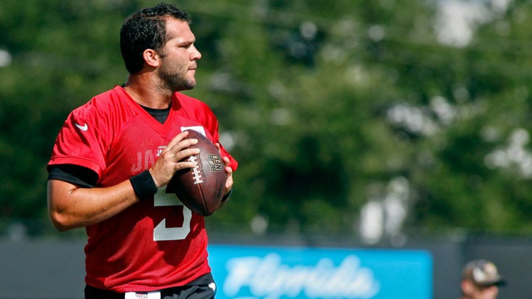 Jul 25, 2014; Jacksonville, FL, USA; Jacksonville Jaguars quarterback Blake Bortles (5) goes back to pass during the first day of training camp at Florida Blue Health and Wellness Practice Fields. Mandatory Credit: Phil Sears-USA TODAY Sports