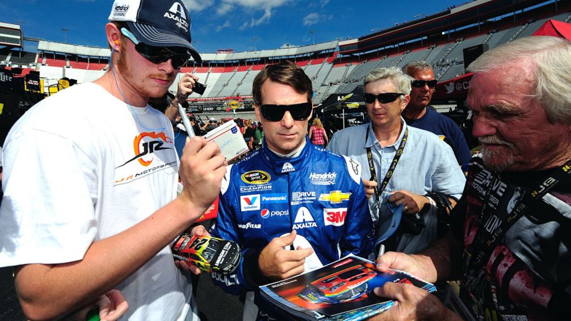 BRISTOL, TN - AUGUST 21: Jeff Gordon, driver of the #24 Axalta Chevrolet, signs autographs during practice for the NASCAR Sprint Cup Series Irwin Tools Night Race at Bristol Motor Speedway on August 21, 2015 in Bristol, Tennessee. (Photo by Jeff Curry/NASCAR via Getty Images)