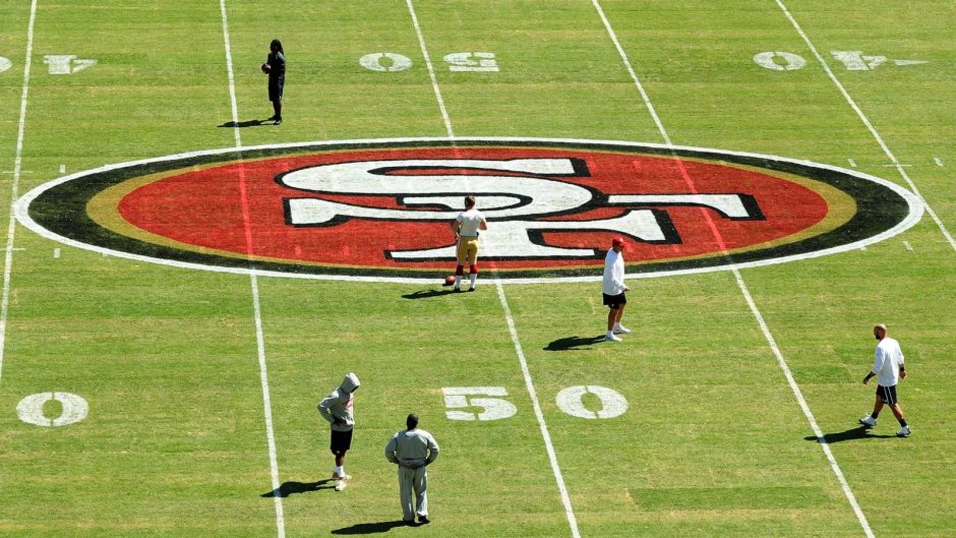 SANTA CLARA, CA - AUGUST Personel stand on the new turf before the San Francisco 49ers play against the San Diego Chargers during a preseason game at Levi's Stadium on August 24, 2014 in Santa Clara, California. (Photo by Noah Graham/Getty Images)