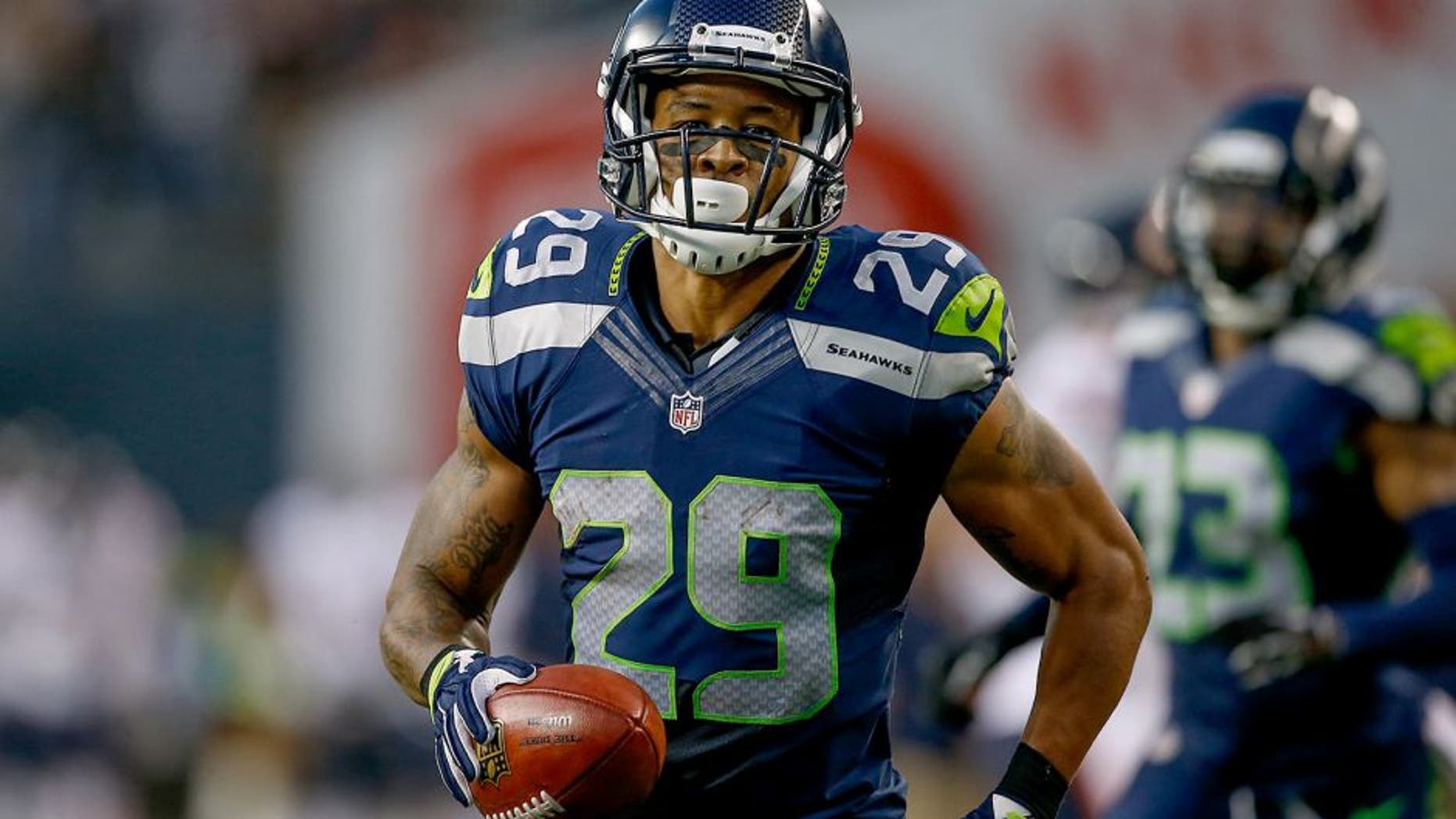 SEATTLE, WA - AUGUST 22: Punt returner Earl Thomas #29 of the Seattle Seahawks reacts after returning a punt for a long gain against the Chicago Bears at CenturyLink Field on August 22, 2014 in Seattle, Washington. (Photo by Otto Greule Jr/Getty Images)