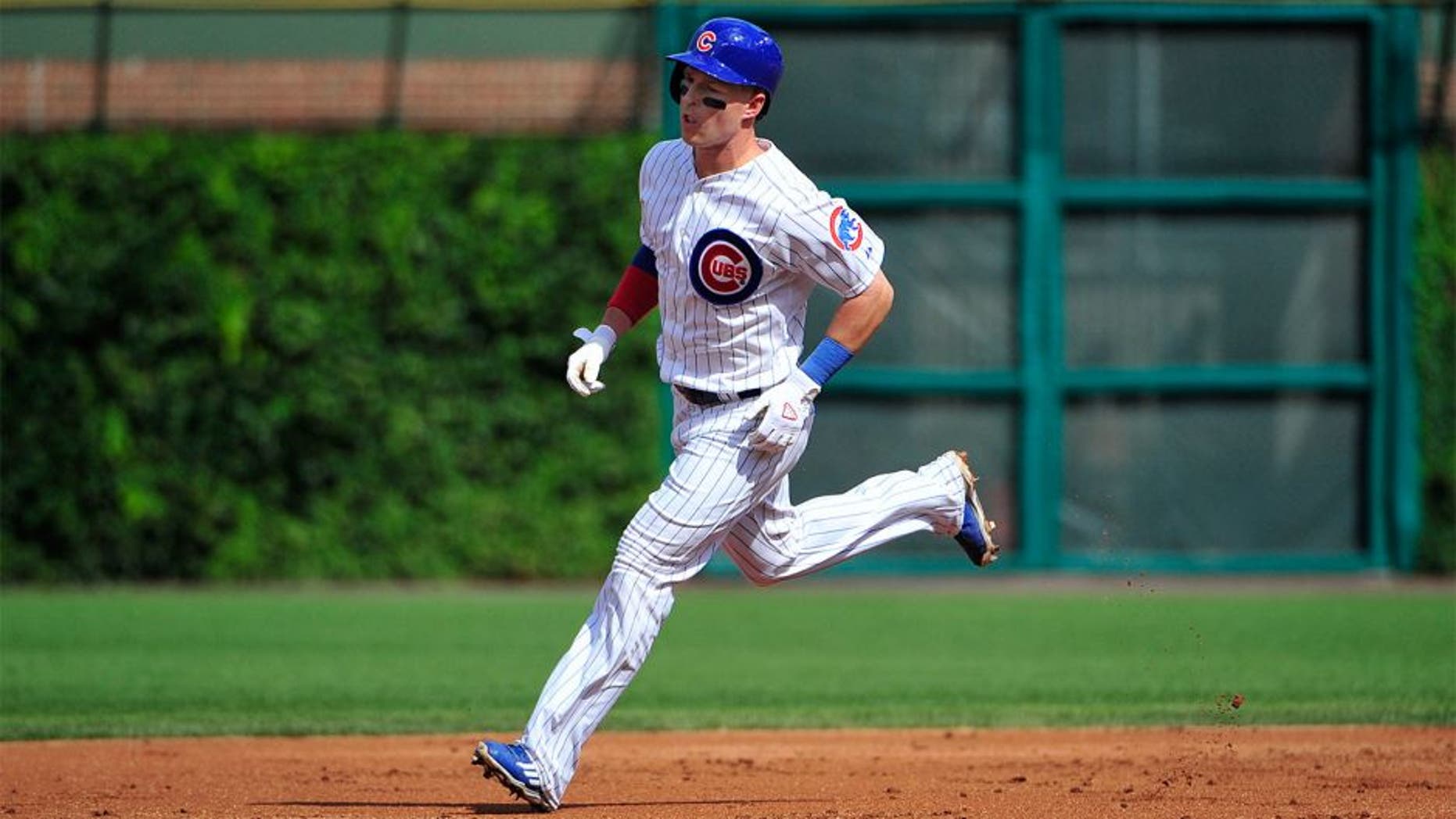 CHICAGO, IL - AUGUST 21: Chris Coghlan #8 of the Chicago Cubs runs the bases after hitting a home run against the Atlanta Braves during the first inning on August 21, 2015 at Wrigley Field in Chicago, Illinois. (Photo by David Banks/Getty Images)