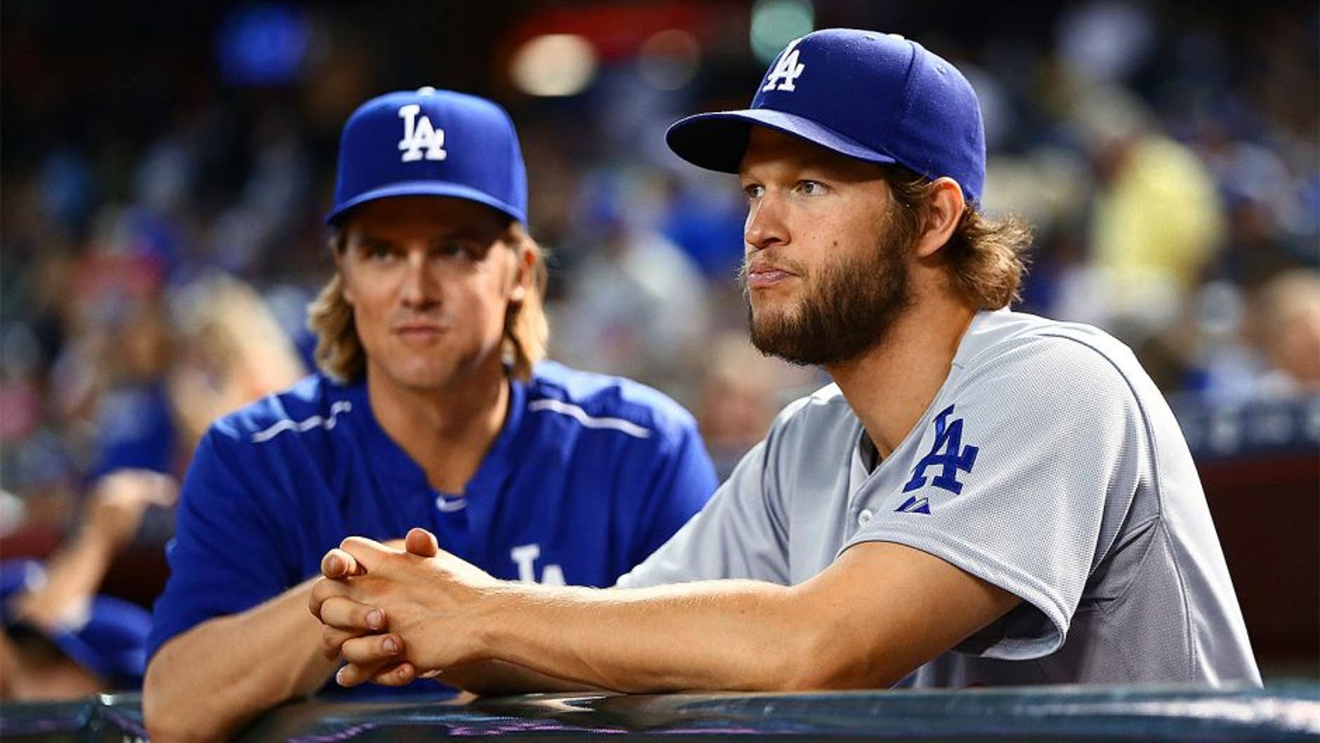Jun 29, 2015; Phoenix, AZ, USA; Los Angeles Dodgers pitcher Clayton Kershaw (right) and Zack Greinke in the first inning against the Arizona Diamondbacks at Chase Field. Mandatory Credit: Mark J. Rebilas-USA TODAY Sports