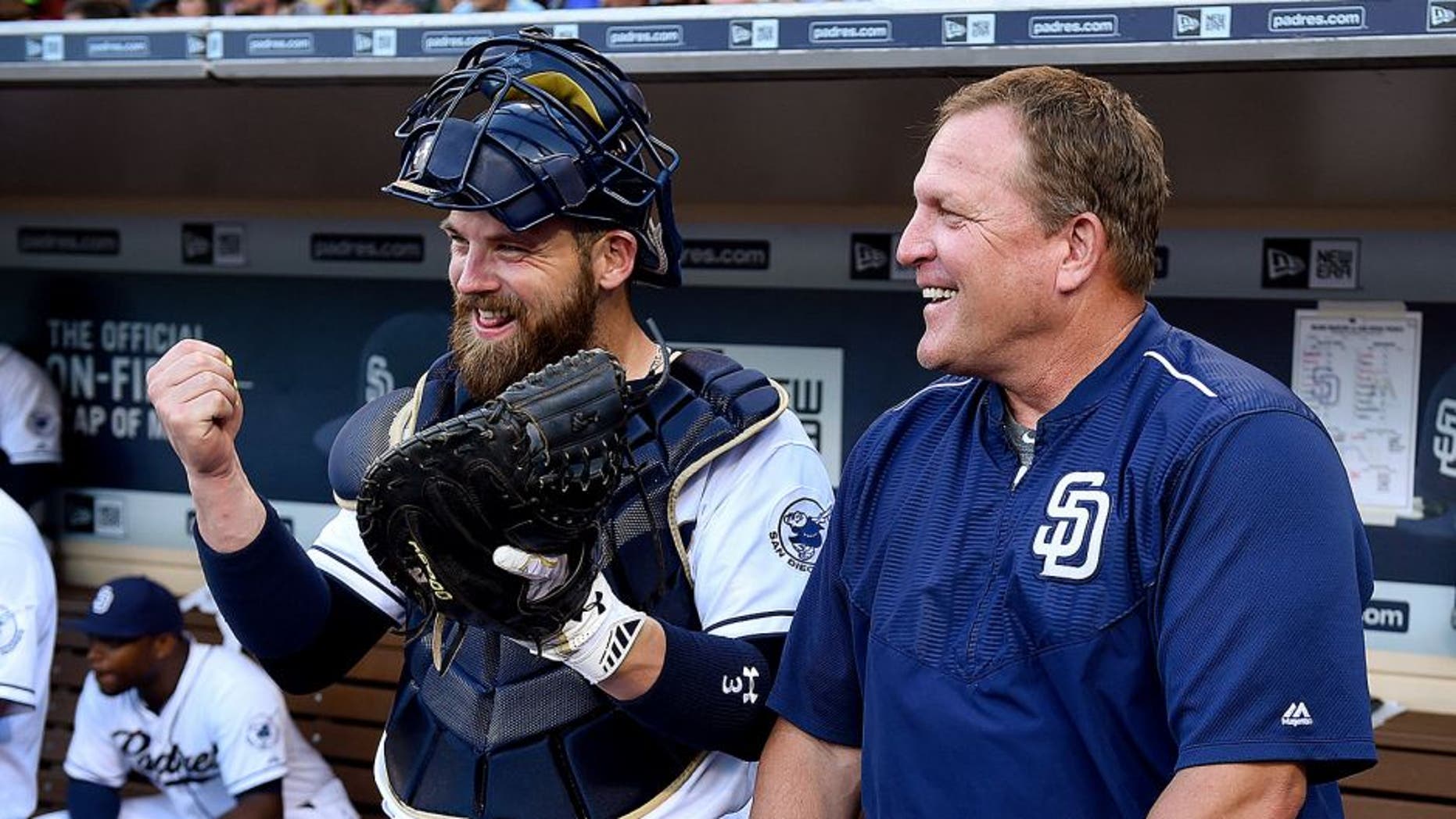 SAN DIEGO, CA - JULY 24: Pat Murphy #24 and Derek Norris #3 of the San Diego Padres talk on the dugout steps prior to the game against the Miami Marlins at Petco Park on July 24, 2015 in San Diego, California. (Photo by Andy Hayt/San Diego Padres/Getty Images)