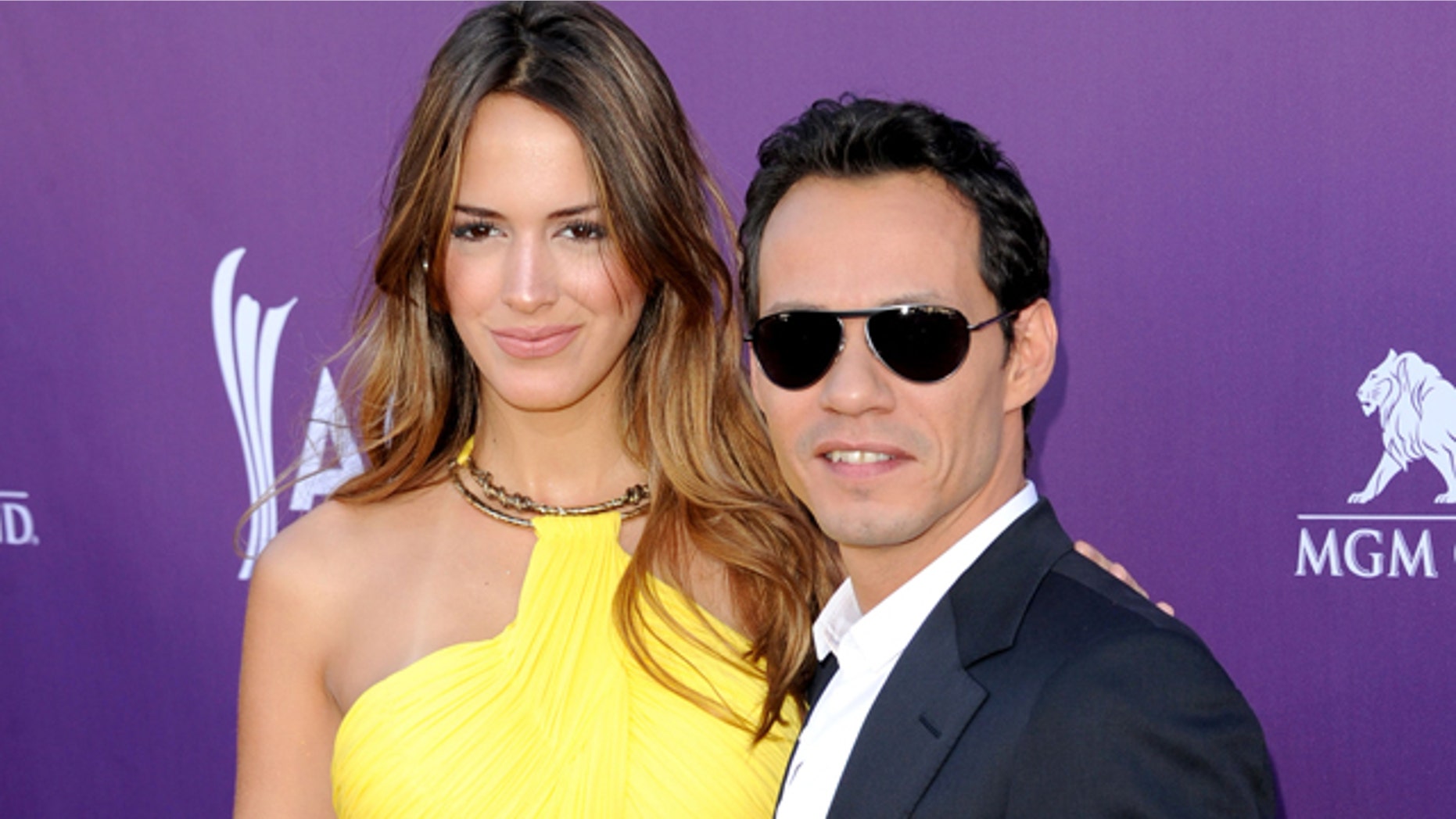 LAS VEGAS, NV - APRIL 01: Singer Marc Anthony (R) and Shannon de Lima arrive at the 47th Annual Academy Of Country Music Awards held at the MGM Grand Garden Arena on April 1, 2012 in Las Vegas, Nevada. (Photo by Jason Merritt/Getty Images)