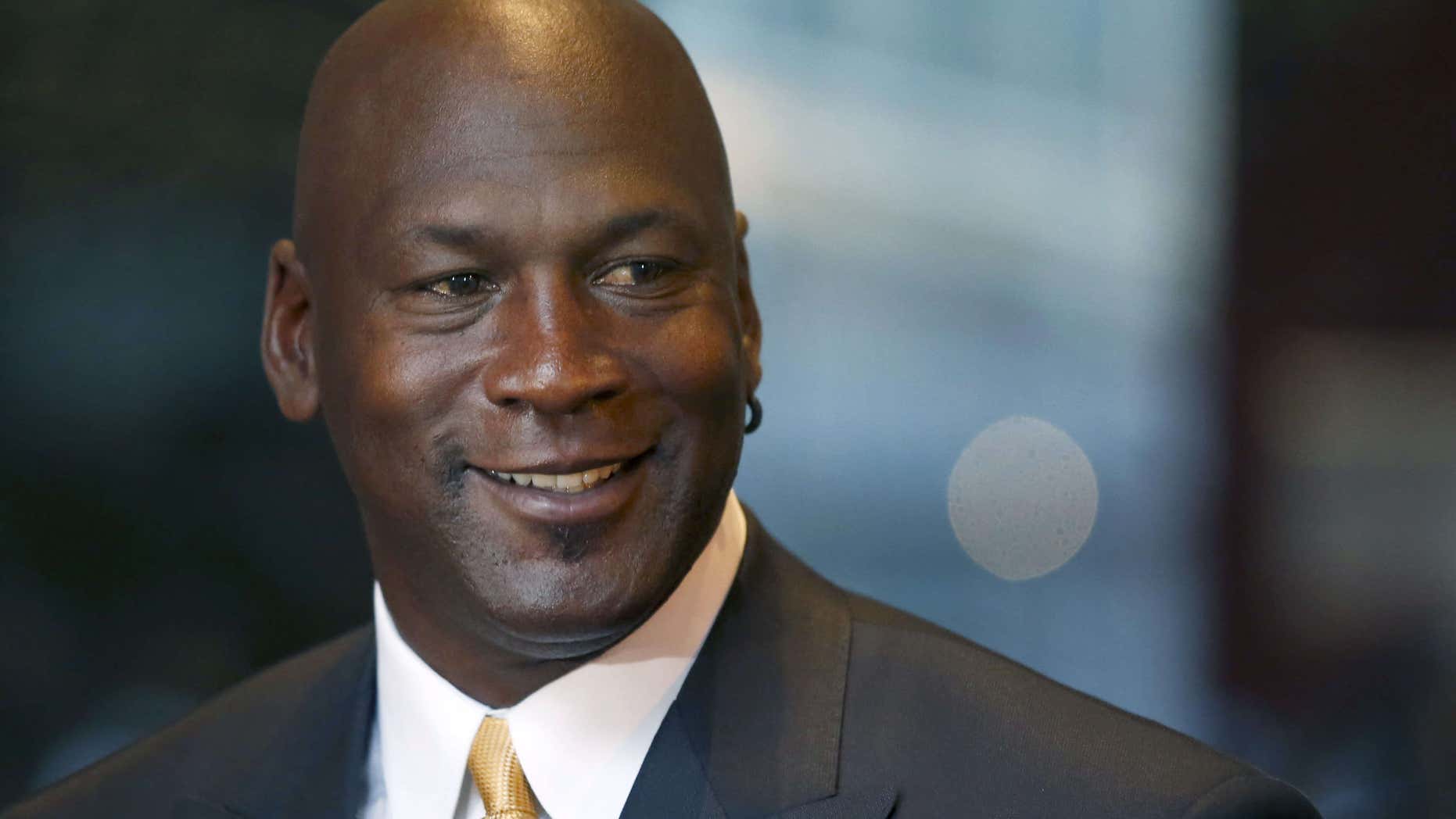 Aug. 21, 2015: Michael Jordan smiles at reporters after a jury ordered a defunct grocery store chain to pay him $8.9 million for using his name without permission.