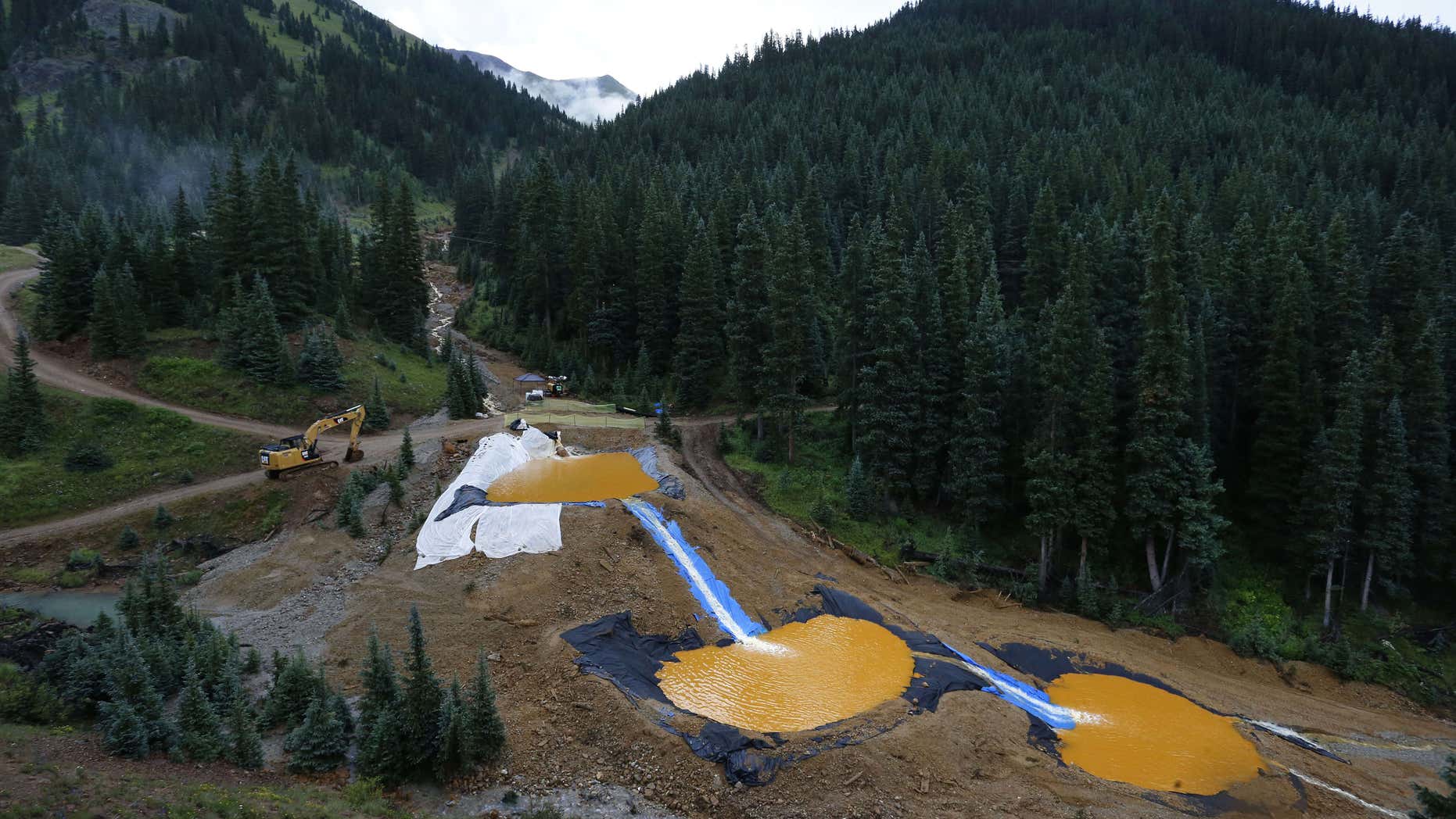Aug. 12, 2015: Water flows through a series of retention ponds built to contain and filter out heavy metals and chemicals from the Gold King mine chemical accident, in the spillway about 1/4 mile downstream from the mine, outside Silverton, Colo.