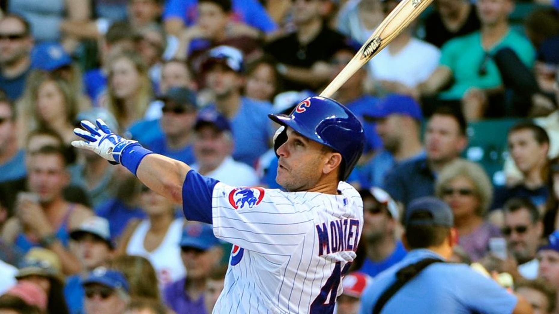 CHICAGO, IL - AUGUST 22: Miguel Montero #47 of the Chicago Cubs hits a home run against the Atlanta Braves during the eighth inning on August 22, 2015 at Wrigley Field in Chicago, Illinois. The Cubs won 9-7.(Photo by David Banks/Getty Images)