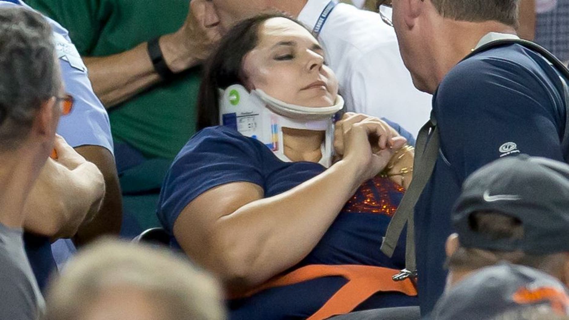 DETROIT, MI - AUGUST 21: A fan is carried out by medics after getting hit in the side of her head by a foul ball in the eighth inning during a MLB game between the Detroit Tigers and the Texas Rangers at Comerica Park on August 21, 2015 in Detroit, Michigan.(Photo by Dave Reginek/Getty Images)