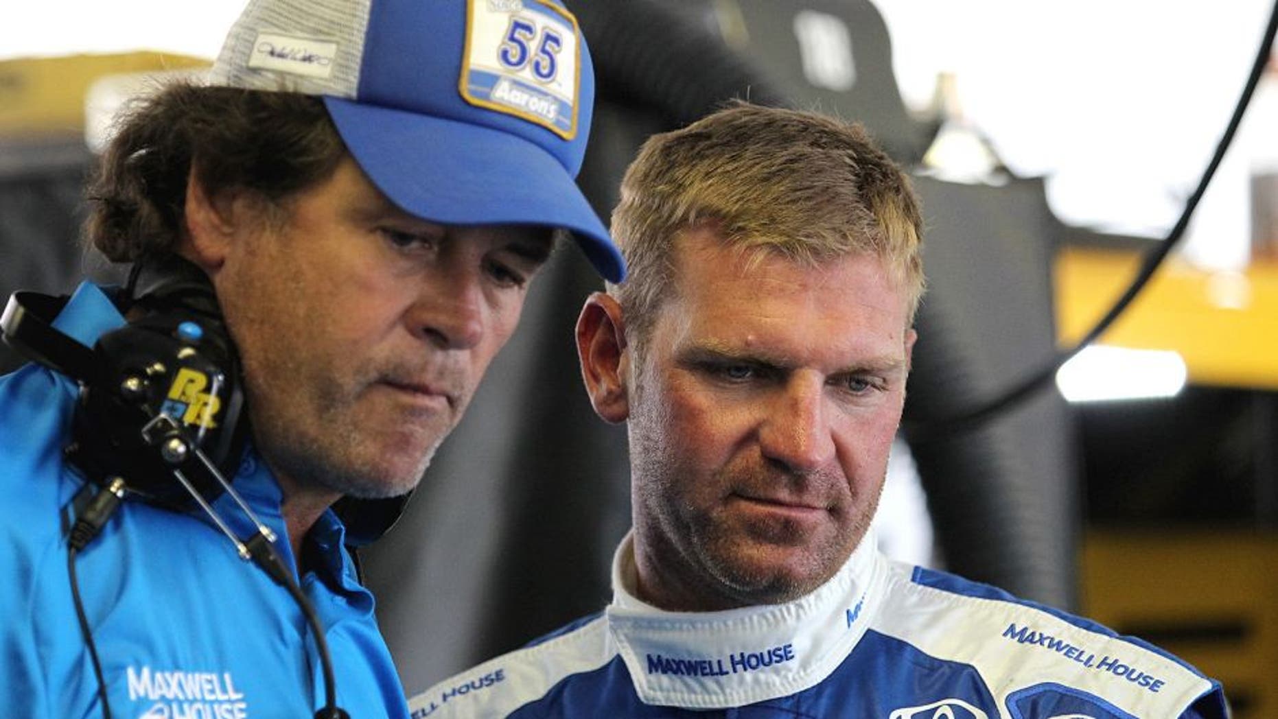 LONG POND, PA - JULY 31: Clint Bowyer, driver of the #15 Maxwell House Toyota, right, talks with team owner Michael Waltrip in the garage area during practice for the NASCAR Sprint Cup Series Windows 10 400 at Pocono Raceway on July 31, 2015 in Long Pond, Pennsylvania. (Photo by Tim Bradbury/Getty Images)