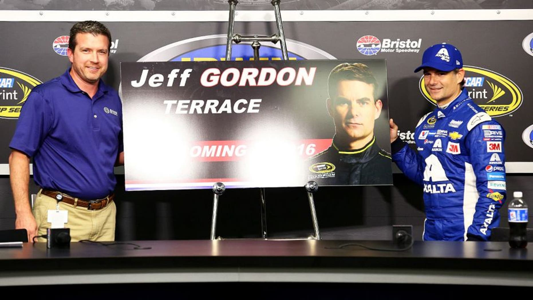 BRISTOL, TN - AUGUST 21: Jerry Caldwell, General Manager Bristol Motorspeedway, presents Jeff Gordon, driver of the #24 Axalta Chevrolet, with a commemorative section of the grandstand named "Jeff Gordan Terrace" during a press conference after practice for the NASCAR Sprint Cup Series Irwin Tools Night Race at Bristol Motor Speedway on August 21, 2015 in Bristol, Tennessee. (Photo by Daniel Shirey/Getty Images)