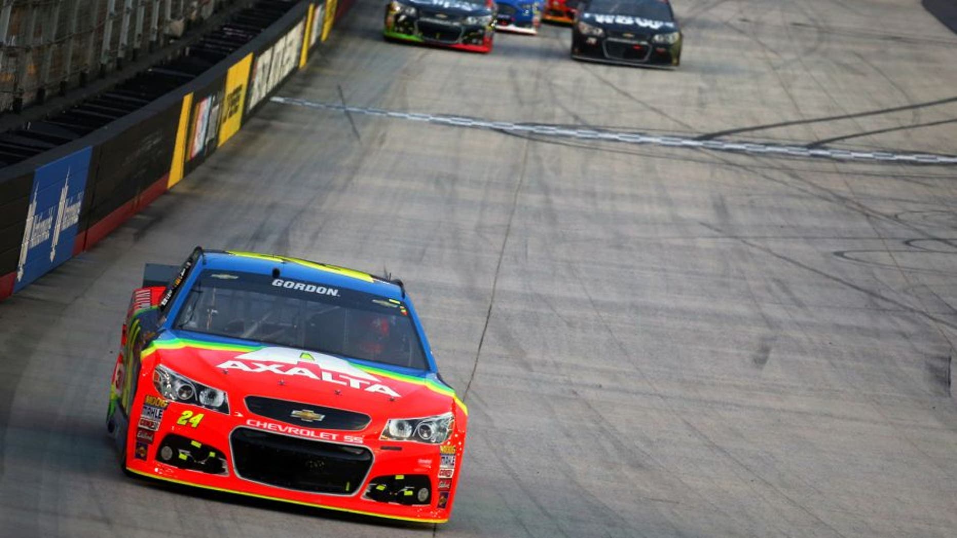 BRISTOL, TN - AUGUST 22: Jeff Gordon, driver of the #24 Axalta Chevrolet, leads a pack of cars during the NASCAR Sprint Cup Series IRWIN Tools Night Race at Bristol Motor Speedway on August 22, 2015 in Bristol, Tennessee. (Photo by Matt Sullivan/NASCAR via Getty Images)