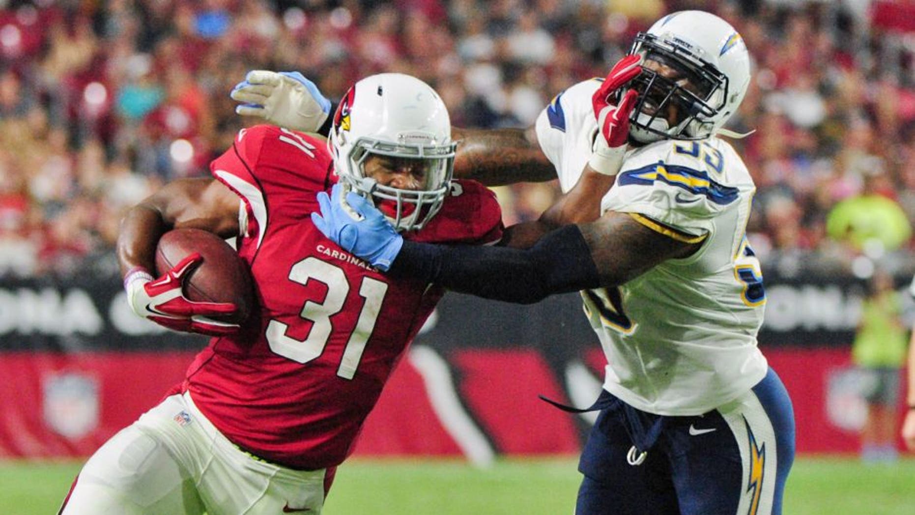 Aug 22, 2015; Glendale, AZ, USA; Arizona Cardinals running back David Johnson (31) carries the ball as San Diego Chargers inside linebacker Kavell Conner (53) defends during the first half at University of Phoenix Stadium. Mandatory Credit: Matt Kartozian-USA TODAY Sports