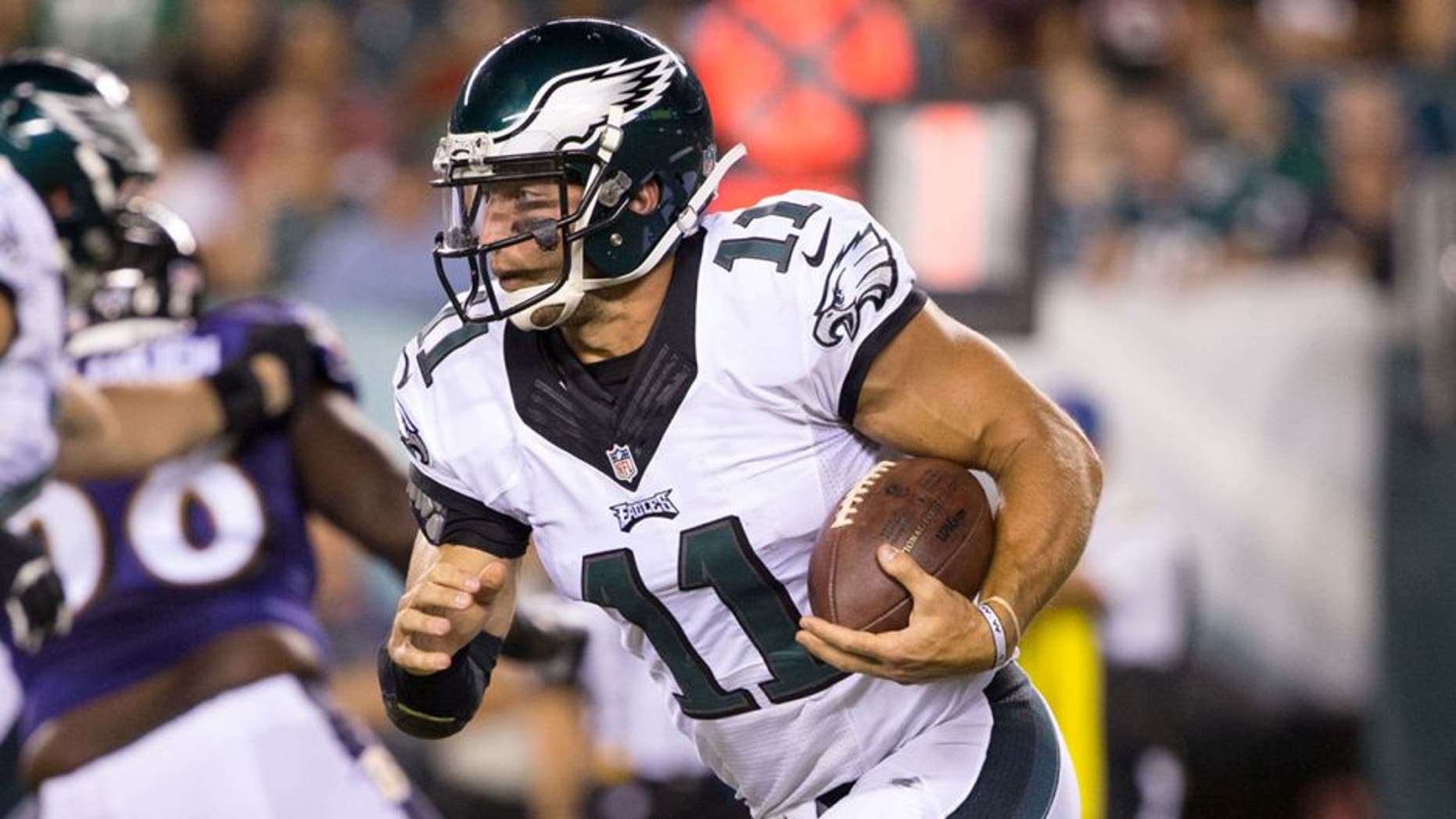Aug 22, 2015; Philadelphia, PA, USA; Philadelphia Eagles quarterback Tim Tebow (11) runs with the ball against the Baltimore Ravens during the fourth quarter at Lincoln Financial Field. The Eagles won 40-17. Mandatory Credit: Bill Streicher-USA TODAY Sports