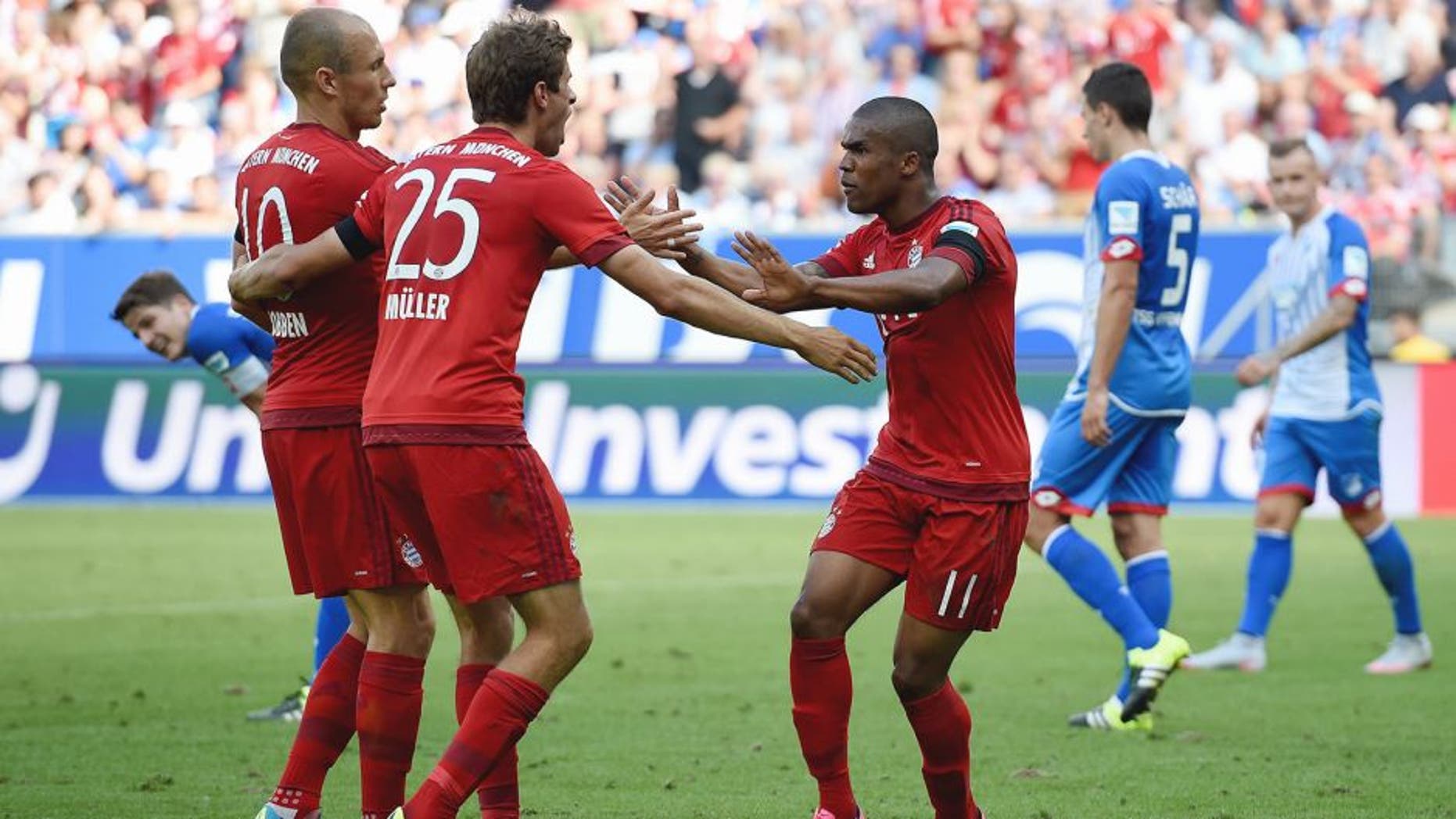 SINSHEIM, GERMANY - AUGUST 22: Thomas Mueller of Muenchen celebrates with his team-mates after scoring his team's first goal during the Bundesliga match between 1899 Hoffenheim and FC Bayern Muenchen at Wirsol Rhein-Neckar-Arena on August 22, 2015 in Sinsheim, Germany. (Photo by Matthias Hangst/Bongarts/Getty Images)