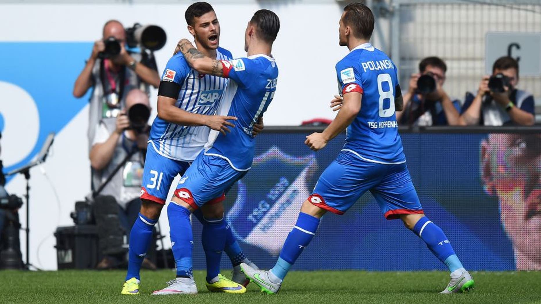 SINSHEIM, GERMANY - AUGUST 22: Kevin Volland of Hoffenheim celebrates with his team-mates after scoring his team's first goal during the Bundesliga match between 1899 Hoffenheim and FC Bayern Muenchen at Wirsol Rhein-Neckar-Arena on August 22, 2015 in Sinsheim, Germany. (Photo by Matthias Hangst/Bongarts/Getty Images)