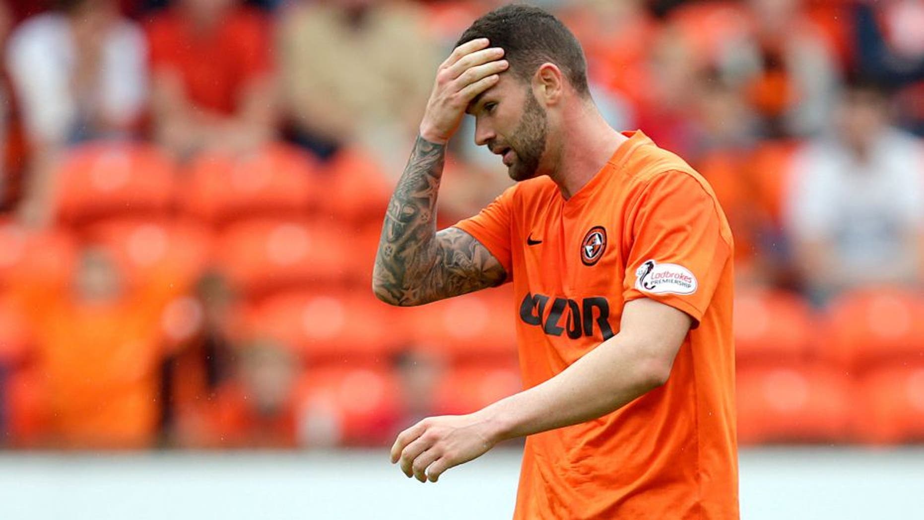 Football - Dundee United v Celtic - Ladbrokes Scottish Premiership - Tannadice Park - 22/8/15 Dundee United's Mark Durnan looks dejected after scoring an own goal for Celtic Action Images via Reuters / Graham Stuart Livepic EDITORIAL USE ONLY. No use with unauthorized audio, video, data, fixture lists, club/league logos or "live" services. Online in-match use limited to 45 images, no video emulation. No use in betting, games or single club/league/player publications. Please contact your account representative for further details.