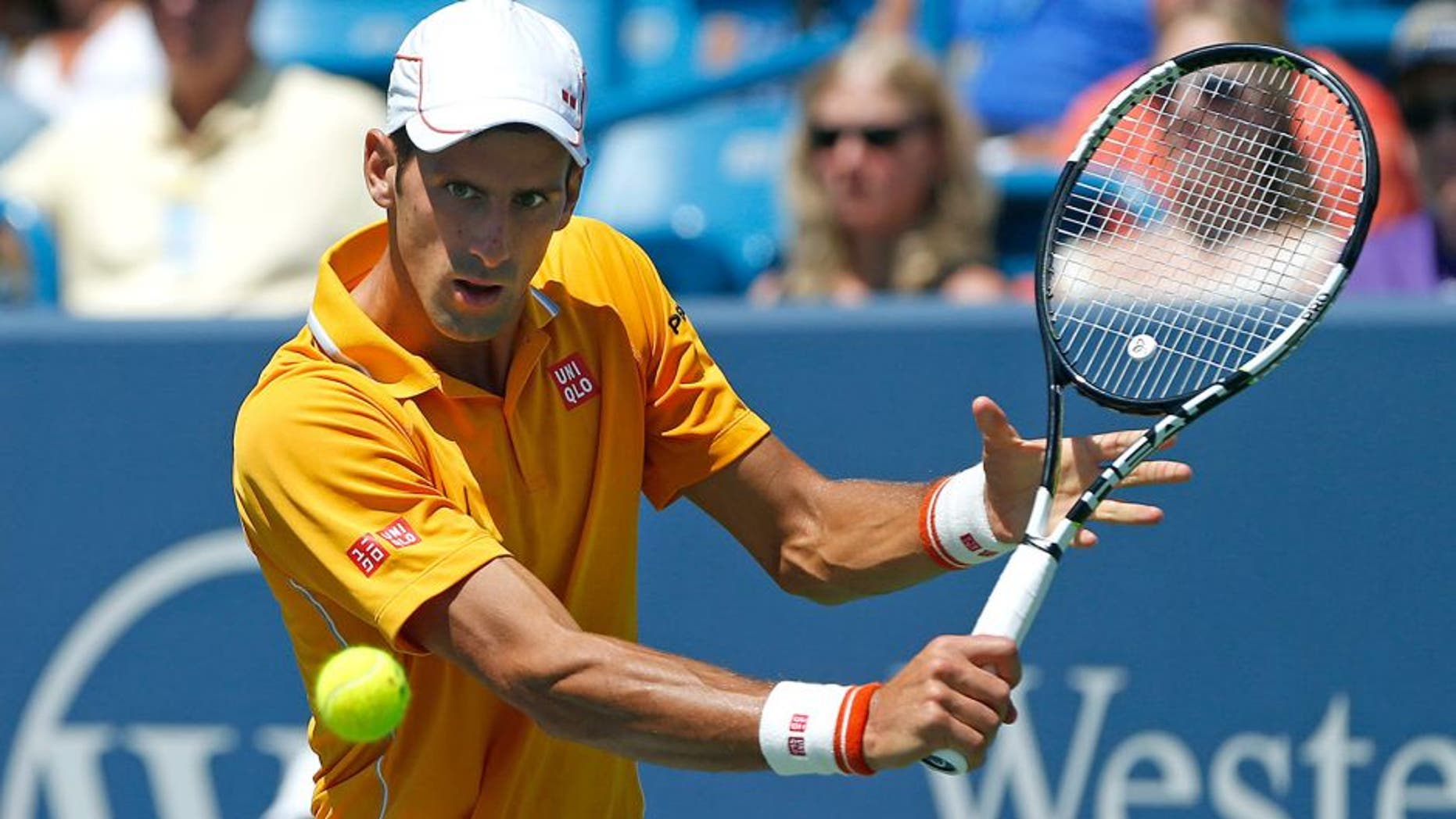 Aug 22, 2015; Cincinnati, OH, USA; Novak Djokovic (SRB) returns a shot against Alexandr Dolgopolov (not pictured) in the semifinals during the Western and Southern Open tennis tournament at the Linder Family Tennis Center. Mandatory Credit: Aaron Doster-USA TODAY Sports