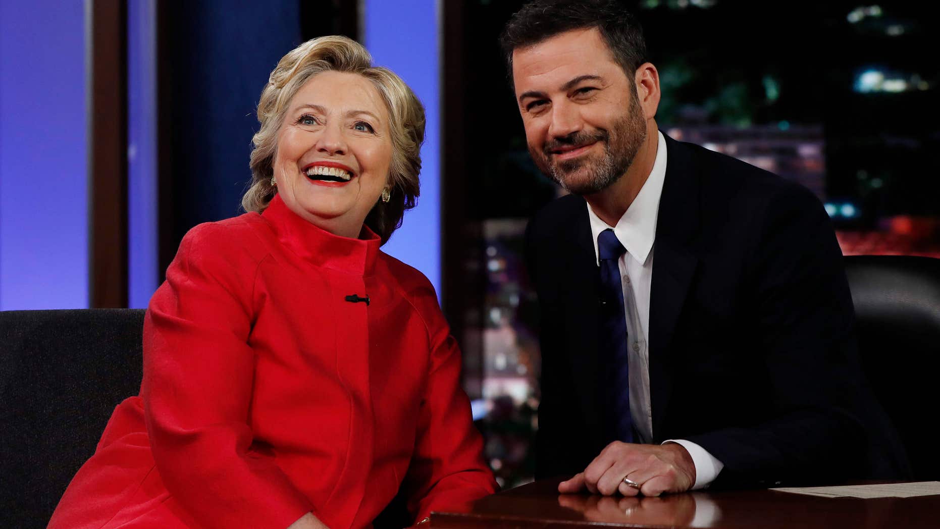 Aug. 22, 2016: Democratic presidential nominee Hillary Clinton pauses to pose for a photograph as she talks with Jimmy Kimmel during a break in taping of "Jimmy Kimmel Live!" in Los Angeles.