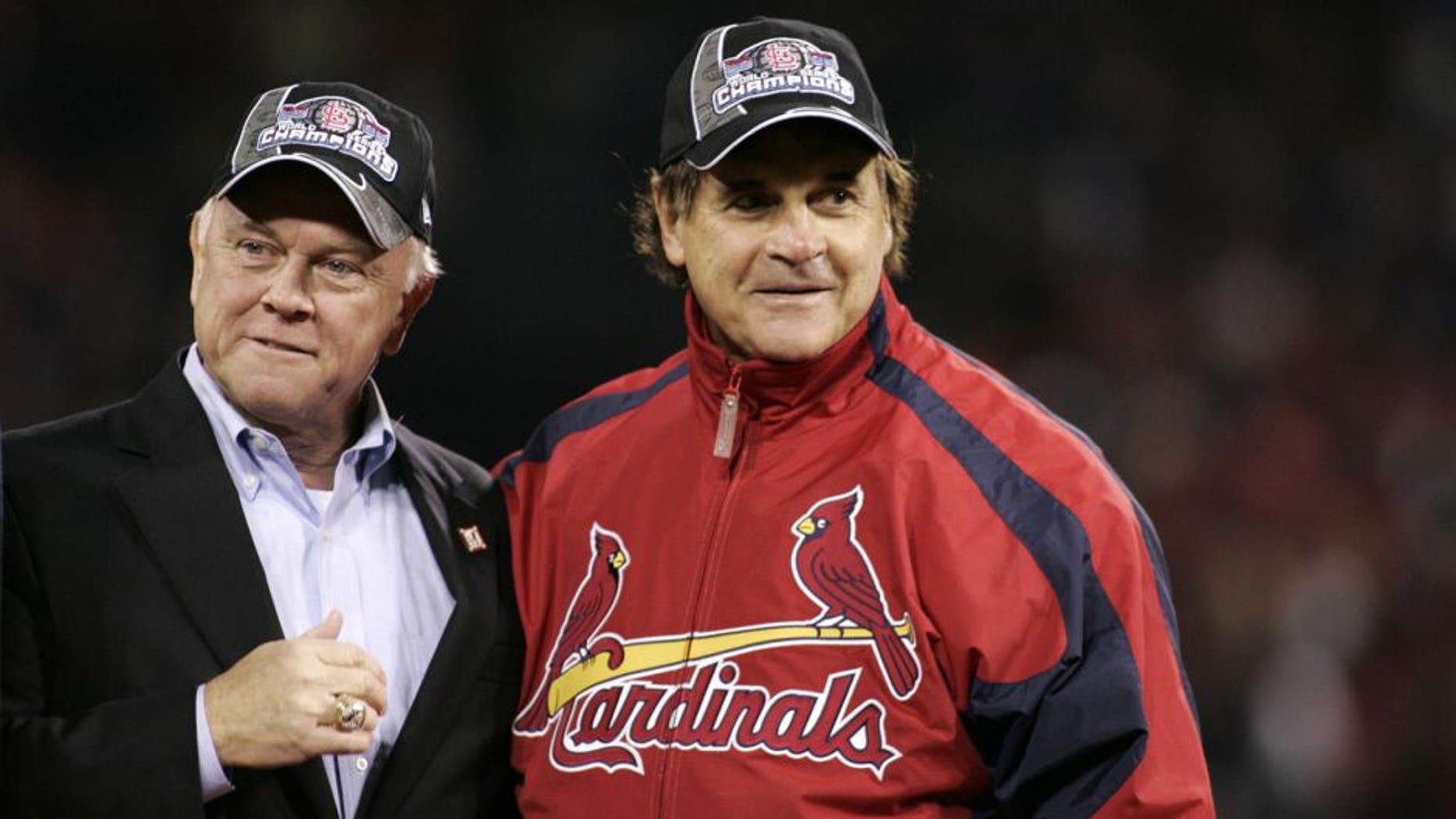 ST LOUIS, MO - OCTOBER 27: General manager Walt Jocketty and manager Tony La Russa of the St. Louis Cardinals celebrate on the field after defeating the Detroit Tigers in Game Five of the 2006 World Series on October 27, 2006 at Busch Stadium in St. Louis, Missouri. The Cardinals defeated the Tigers 4-2 to win the World Series 4 games to 1.(Photo by Rob Tringali/Sportschrome/Getty Images)