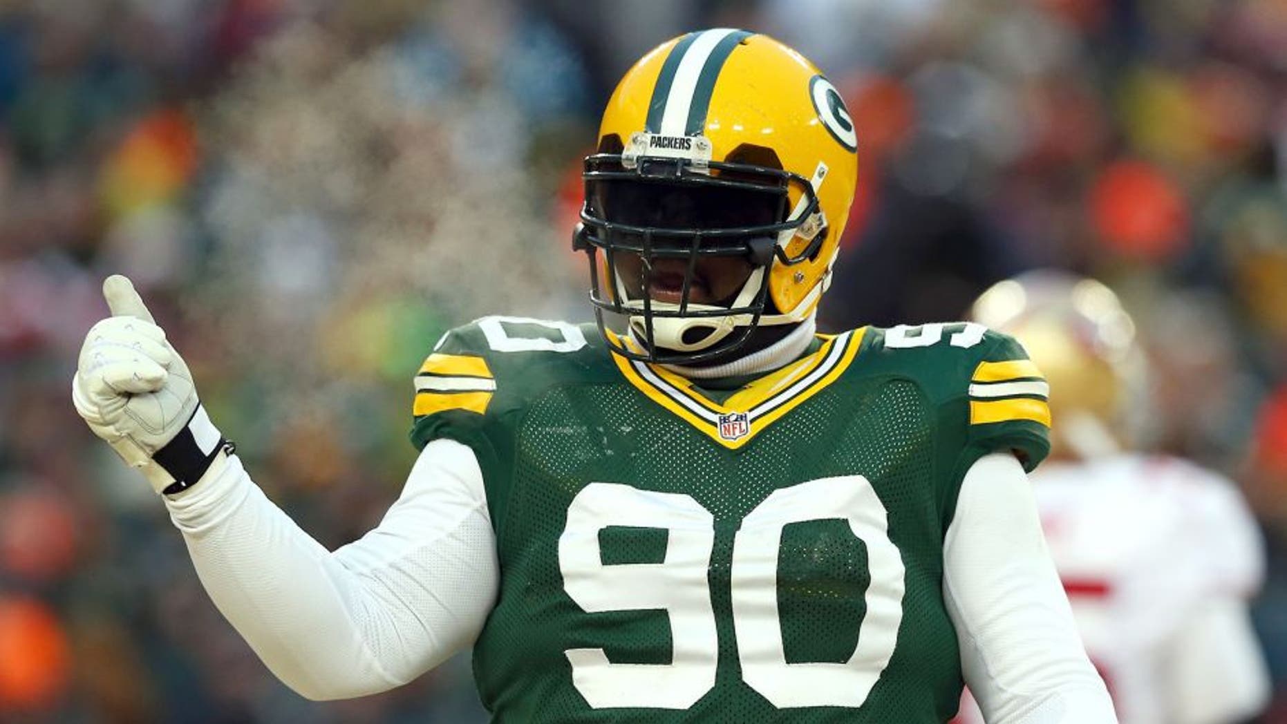GREEN BAY, WI - JANUARY 05: B.J. Raji #90 of the Green Bay Packers celebrates a incomplete pass by the San Francisco 49ers in the first quarter during their NFC Wild Card Playoff game at Lambeau Field on January 5, 2014 in Green Bay, Wisconsin. (Photo by Ronald Martinez/Getty Images)